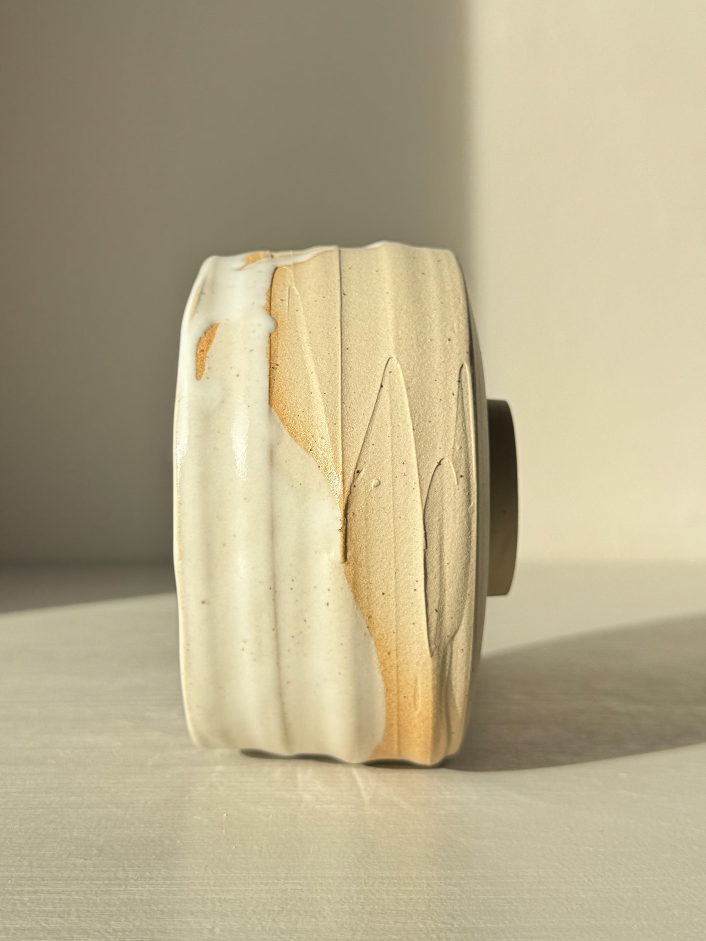 Side view of Matcha Bowl – Glossy White #05 with speckled stoneware and white glaze showing texture and color contrast.