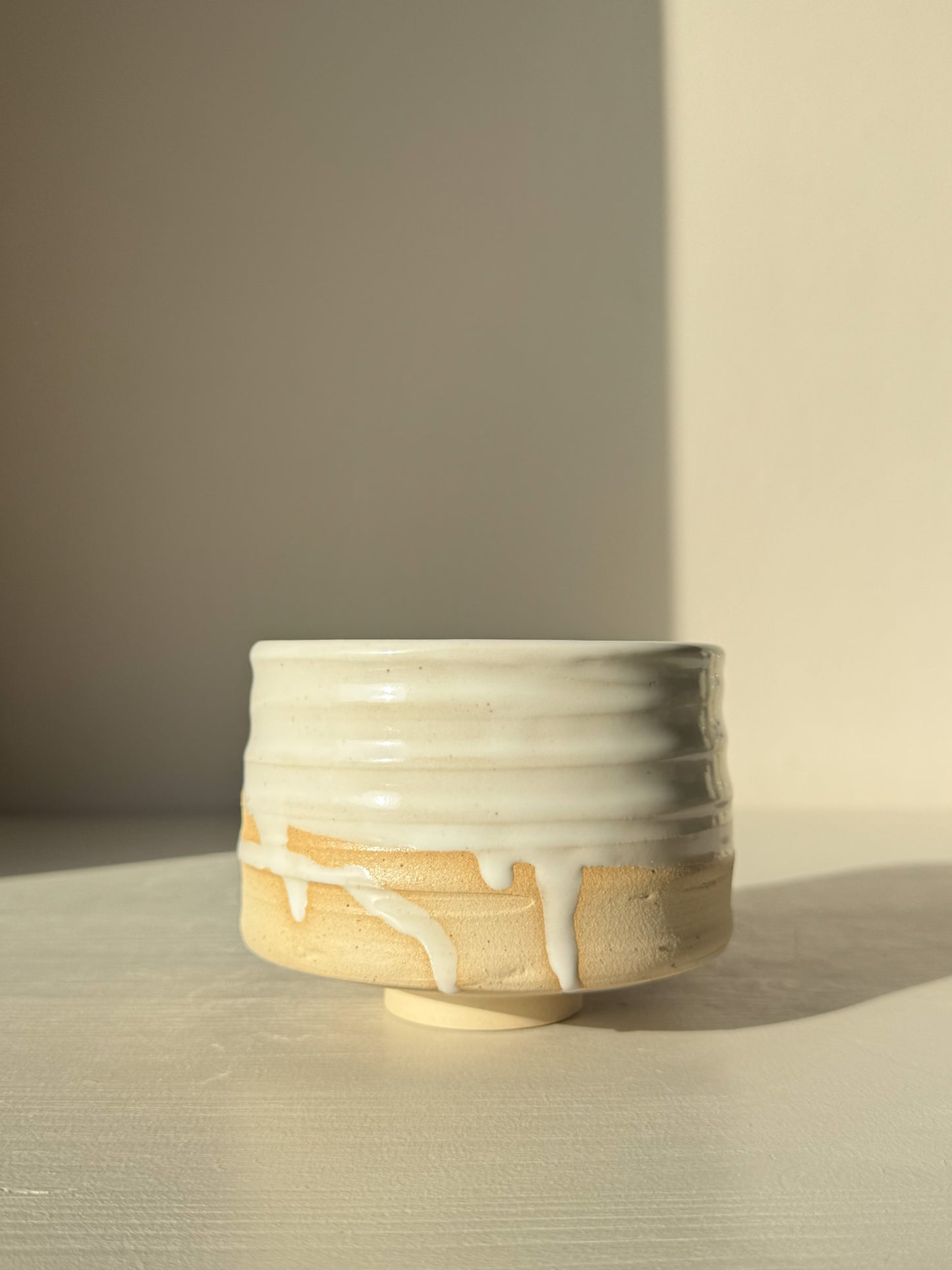 Matcha Bowl – Glossy White #04 with speckled clay, glossy glaze, and textured surface showing wheel markings.