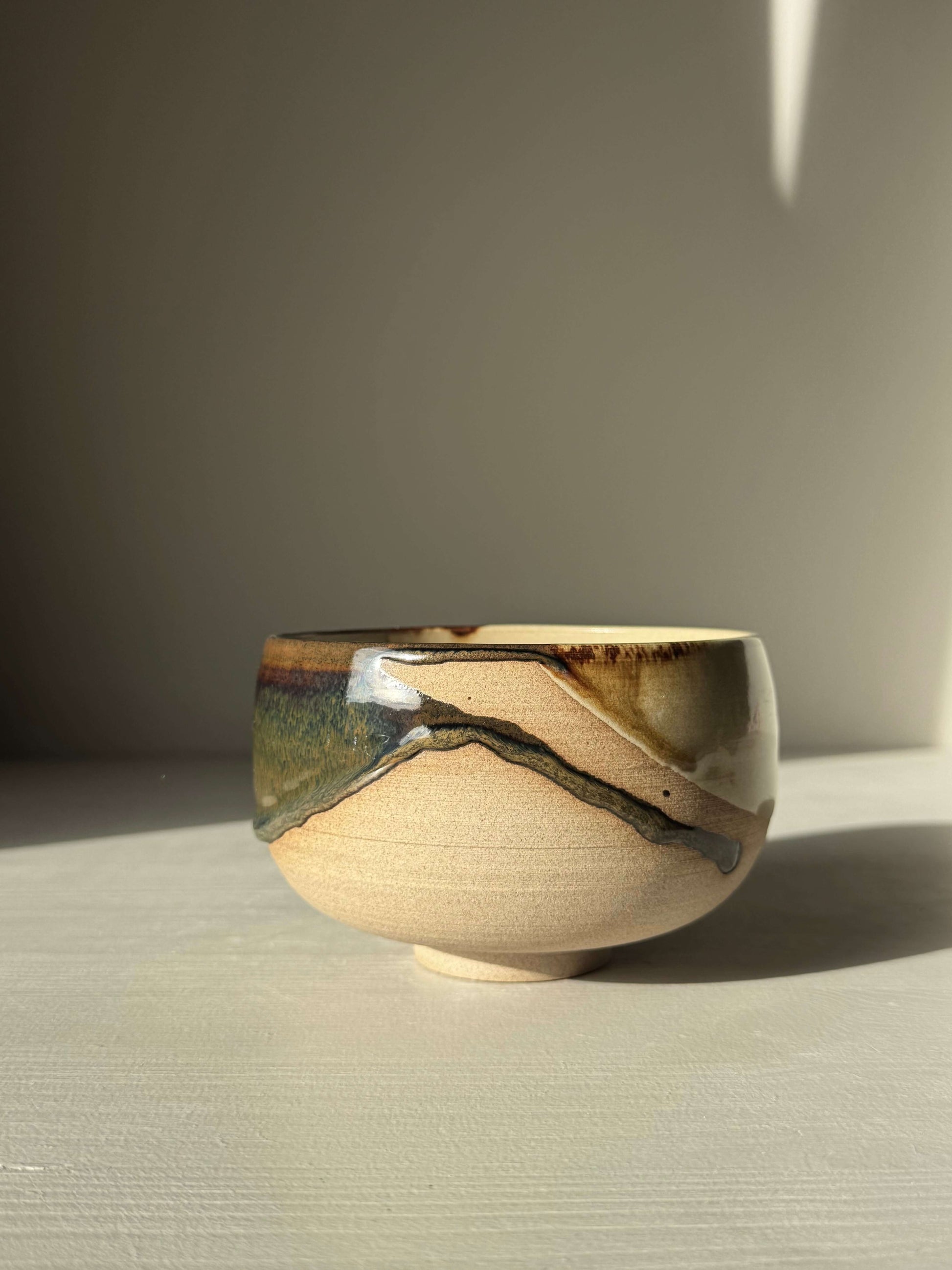 Handmade ceramic Matcha Bowl – Inyo #04 featuring tenmoku and clear glazes on stoneware clay, wheel-thrown and glazed by hand.