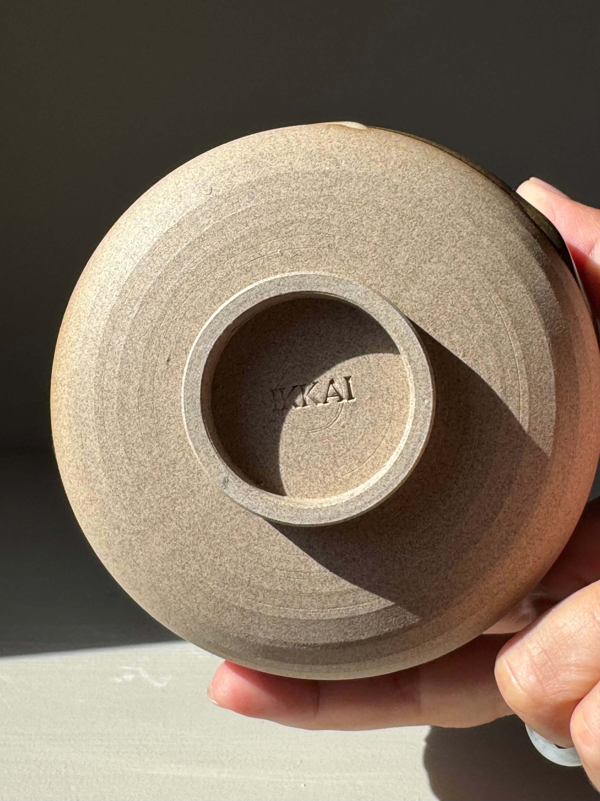 Bottom view of a handmade Matcha Bowl – Inyo Series #04, showcasing detailed craftsmanship and stoneware texture.