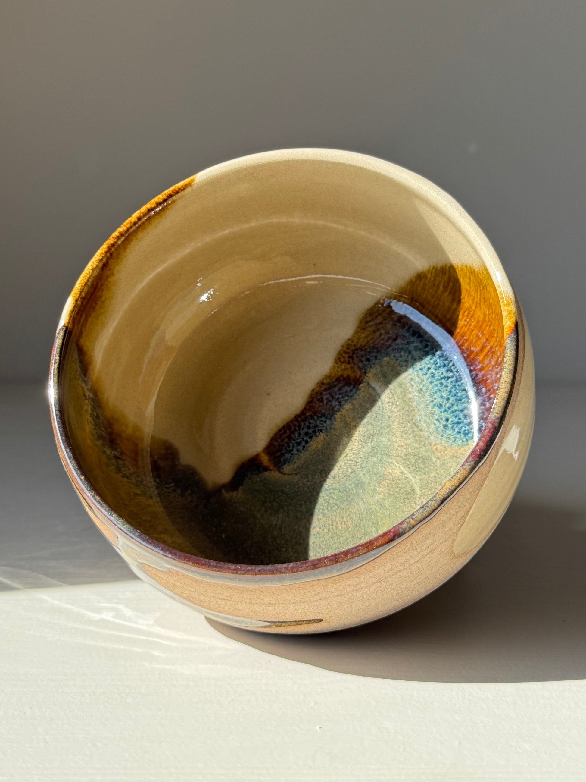 Handmade ceramic Matcha Bowl – Inyo Series #05 with layered tenmoku and clear glazes on stoneware, showcasing a unique design.