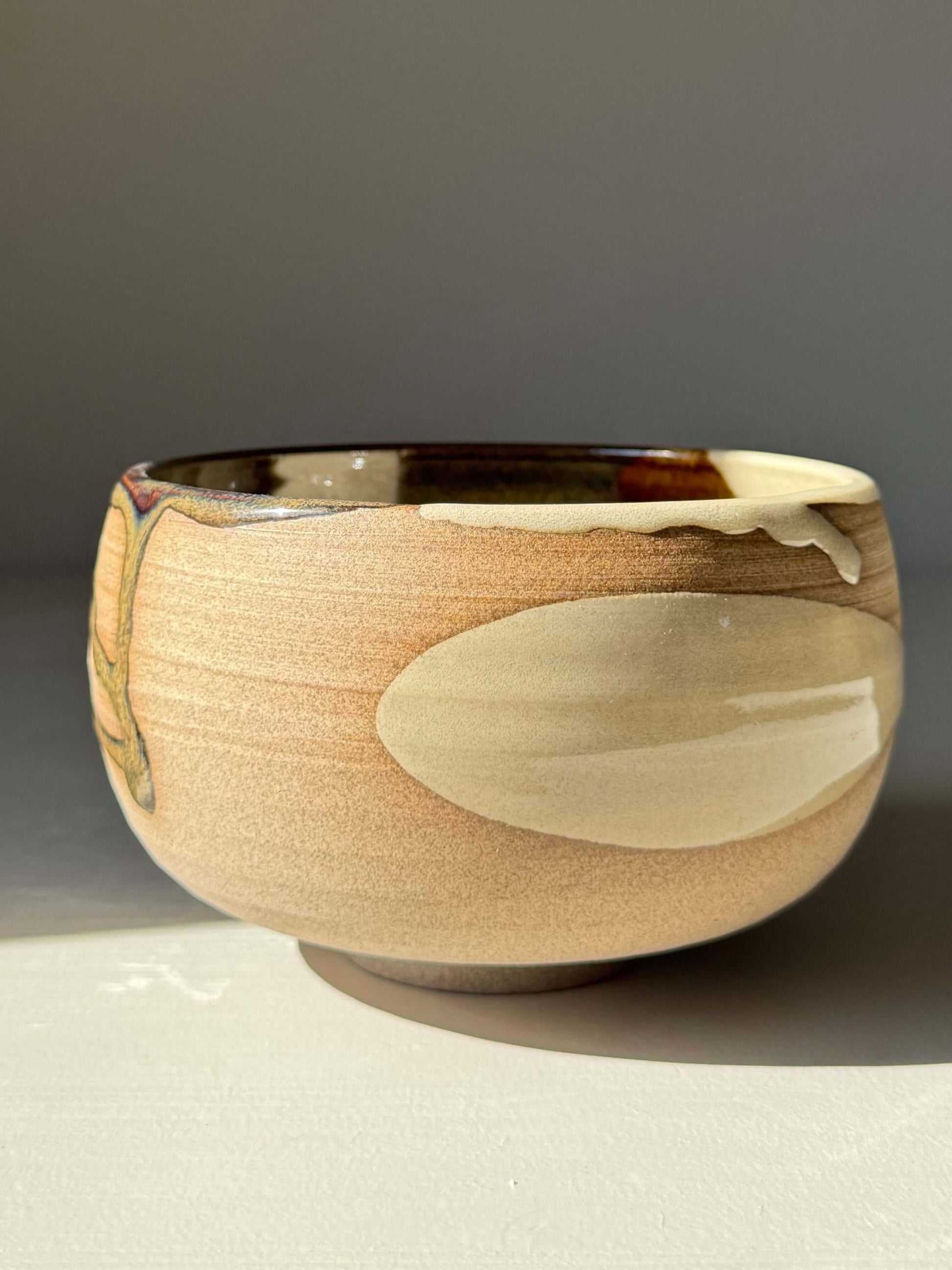 Matcha Bowl – Inyo Series #06 handmade ceramic with glossy tenmoku and clear glazes on warm stoneware clay, unique and wheel-thrown.