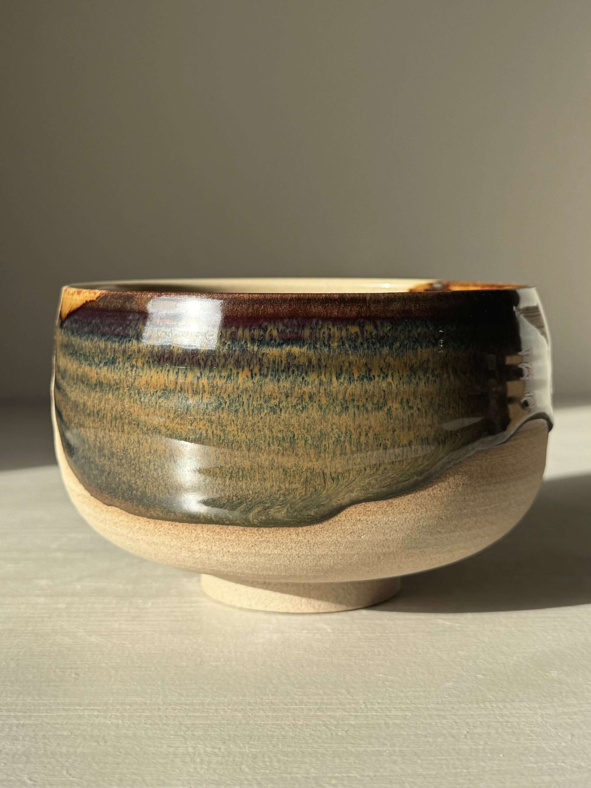 Handmade ceramic Matcha Bowl – Inyo #03 with dark tenmoku and clear glaze on stoneware, unique wheel-thrown design.