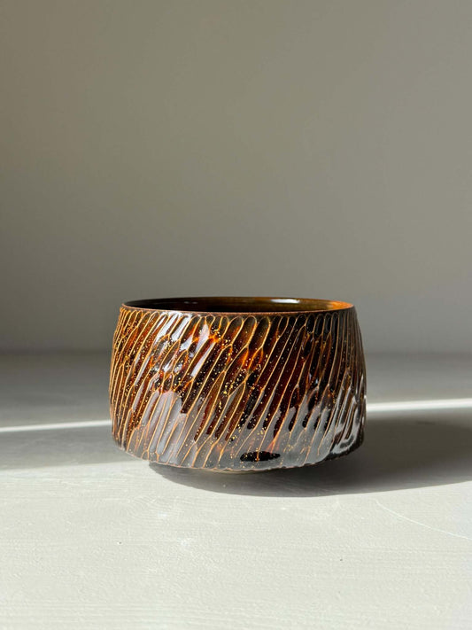 Handmade ceramic Matcha Bowl – Kinsei #05 with glossy brown exterior, featuring rich textures and unique golden star-inspired design.