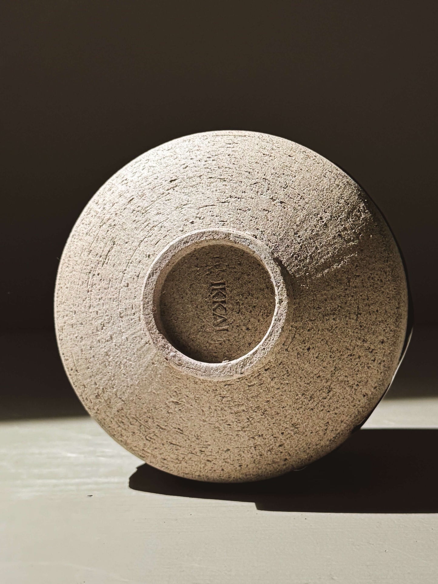 Base view of the Matcha Bowl – Kuro Ash #01, showcasing the textured ash-grey stoneware clay and the handcrafted wheel-thrown design.