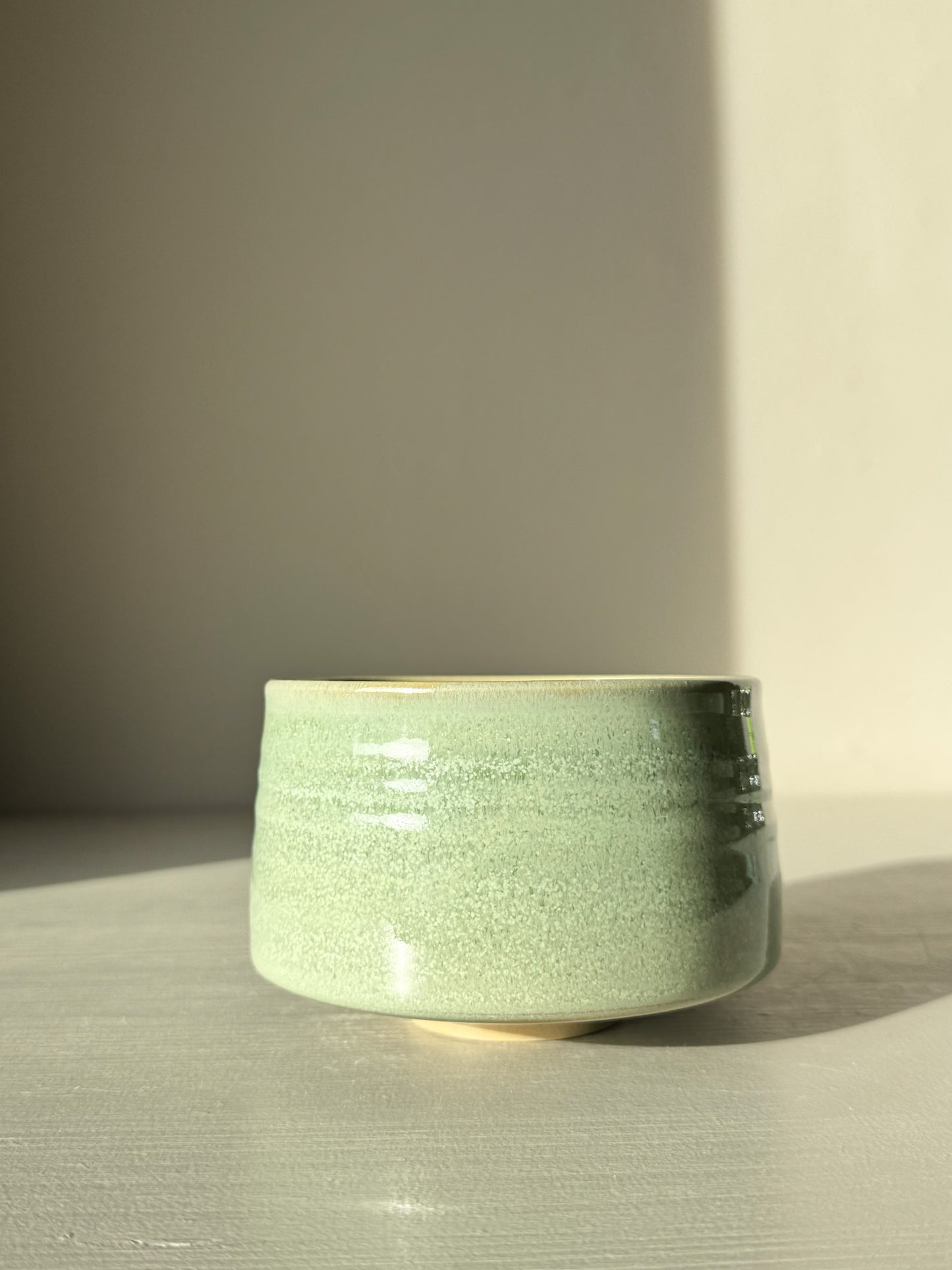 Handmade Matcha Bowl – Sage Glaze #01 with soft green tone and glossy finish, ideal for whisking matcha tea smoothly.