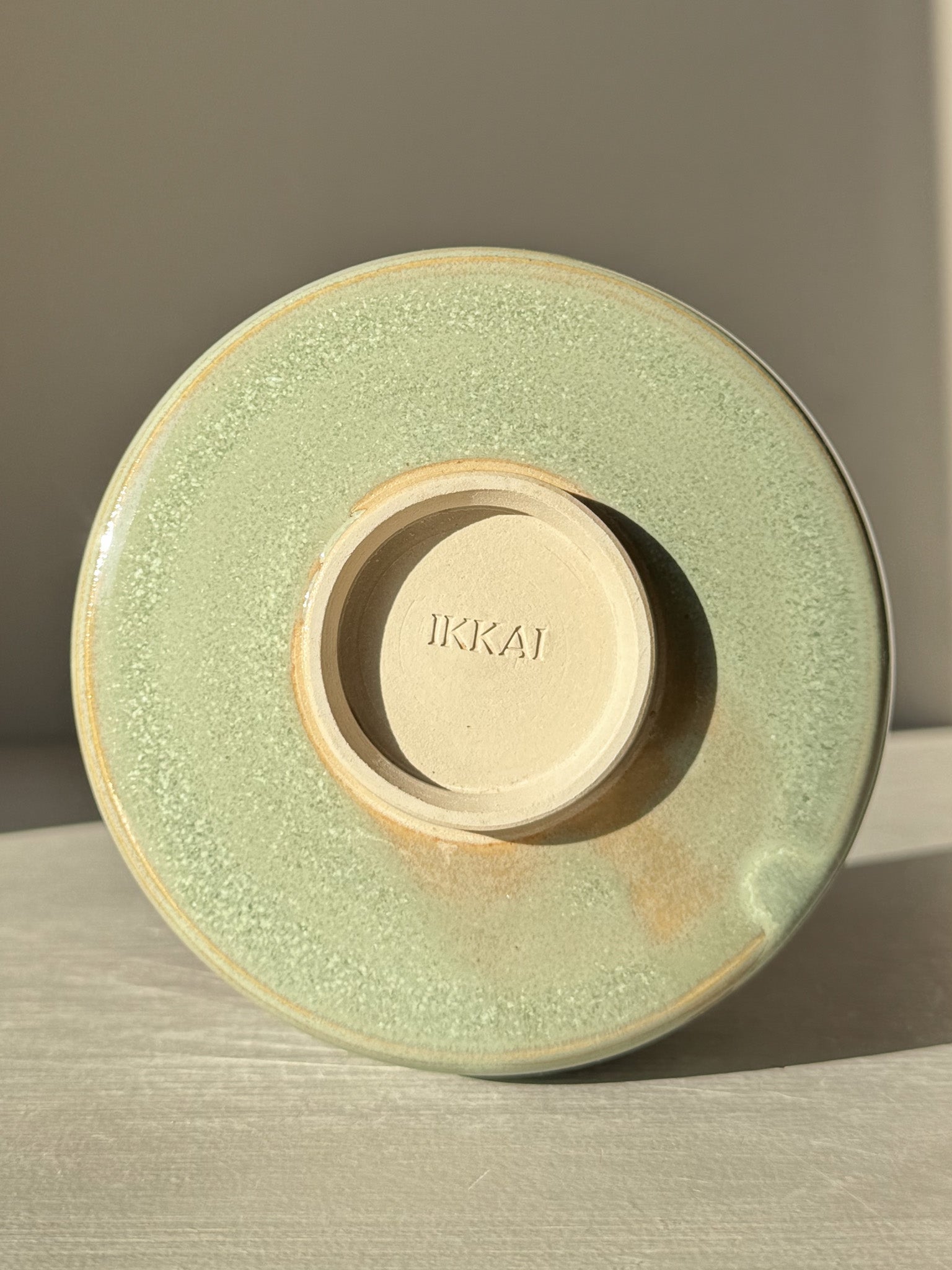 Matcha Bowl – Sage Glaze #02 with soft sage-green glossy finish, showcasing the unique handmade base. Perfect for whisking matcha.
