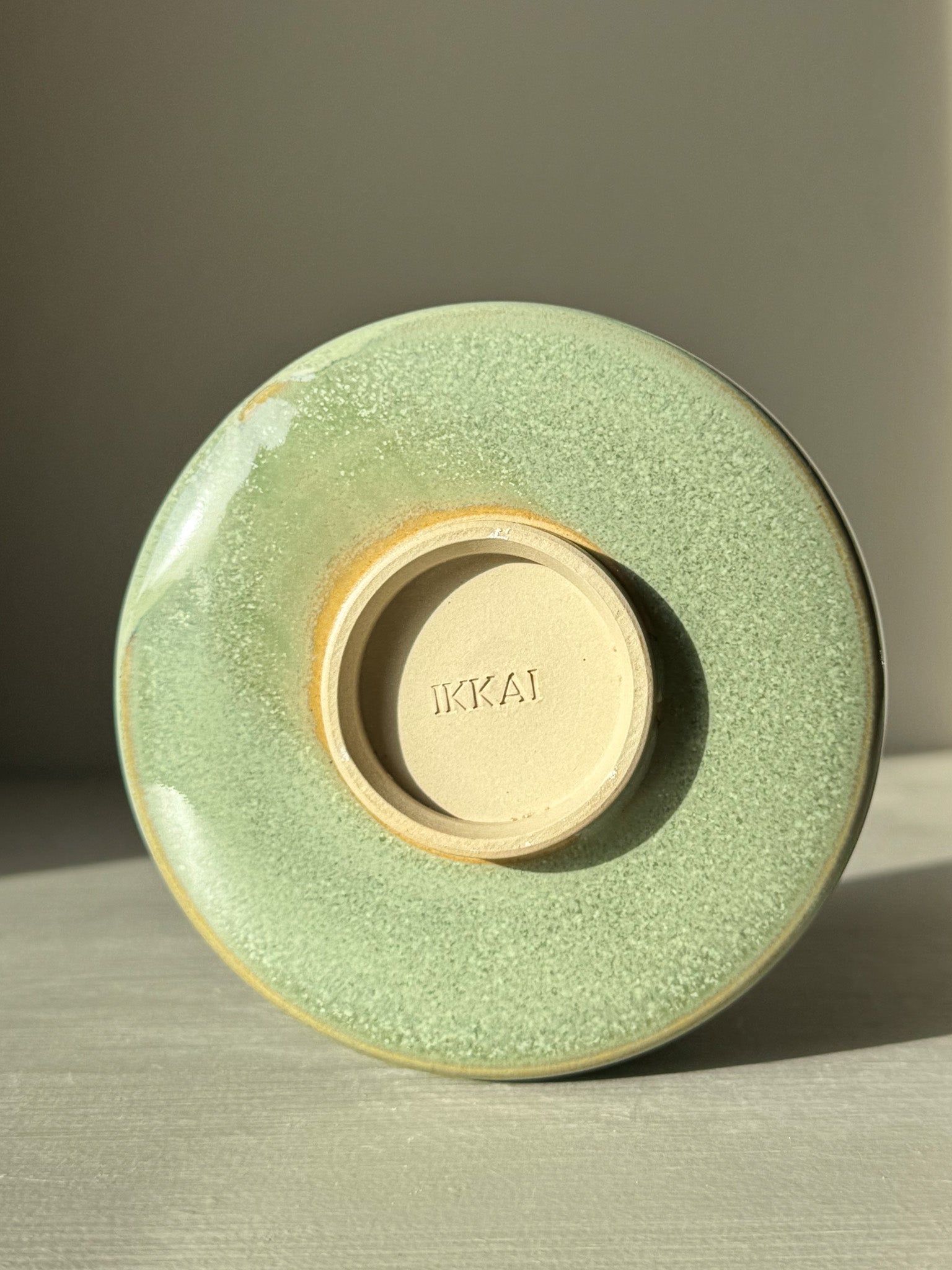 Matcha Bowl – Sage Glaze #01 with soft sage-green tone and glossy finish, showcasing its handcrafted uniqueness on a light surface.