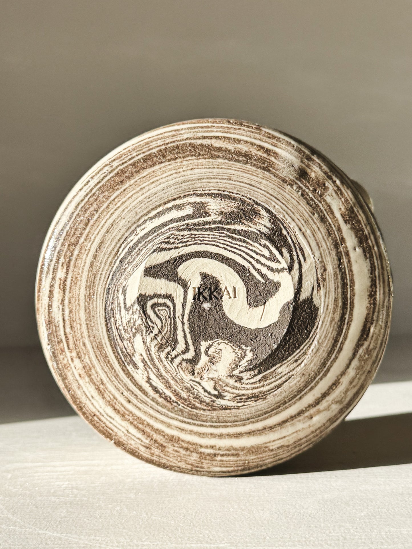 Bottom view of Matcha Bowl Spout - Marbled #01 with natural clay swirls