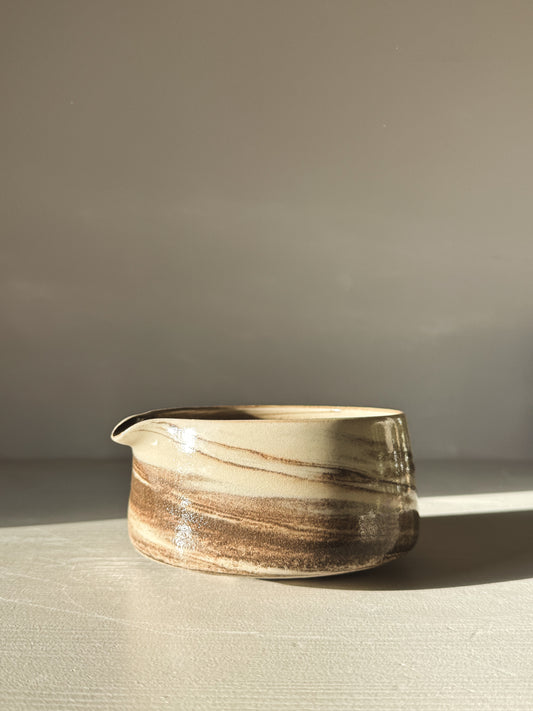 Hand-thrown Matcha Bowl Spout - Marbled #01 with swirling black and white stoneware clay and clear glaze on display.