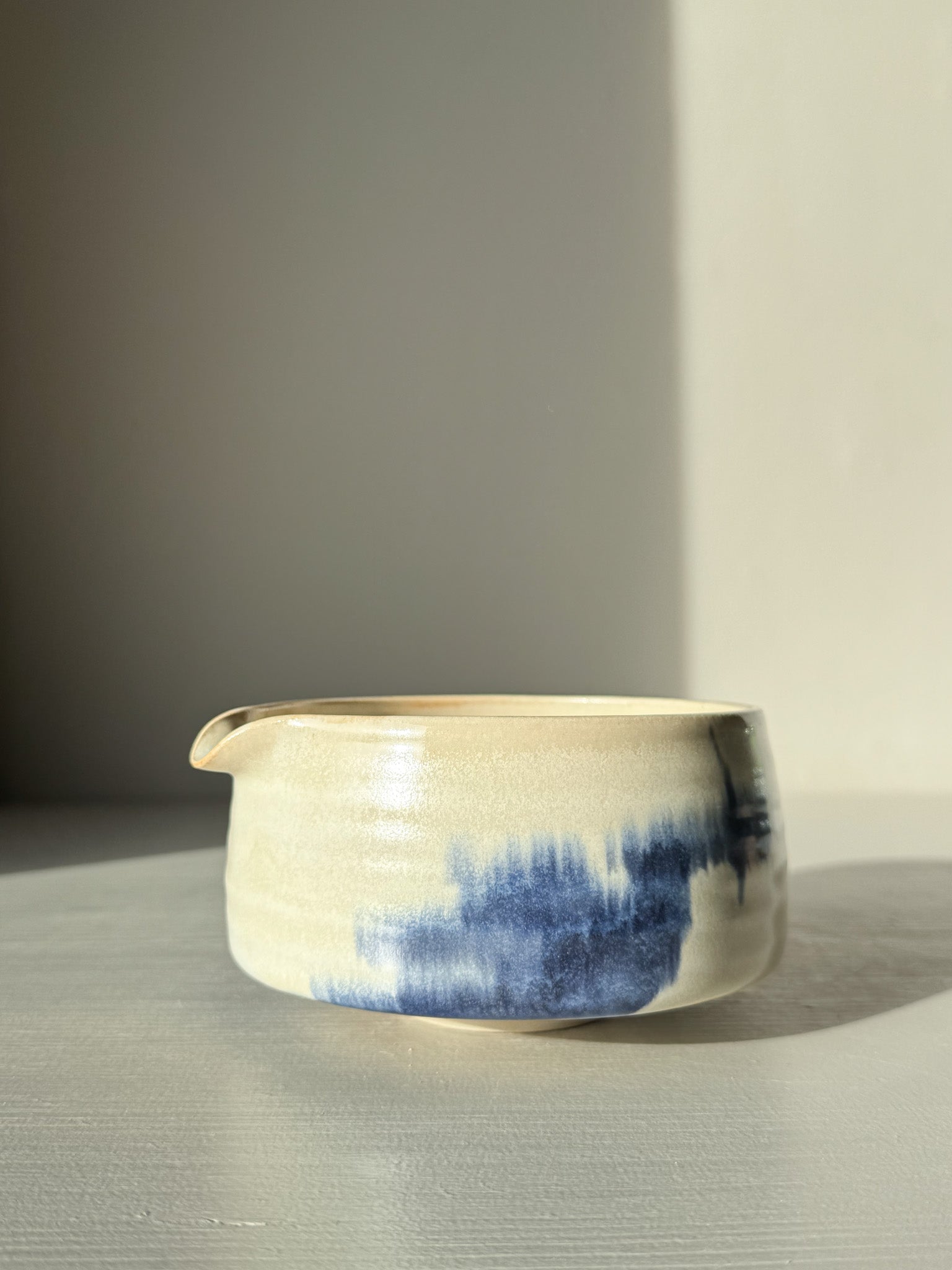 Matcha bowl Spout - Moonstone & Blue #01 with hand-splashed cobalt glaze and moonstone layer, creating a calm and foggy look.