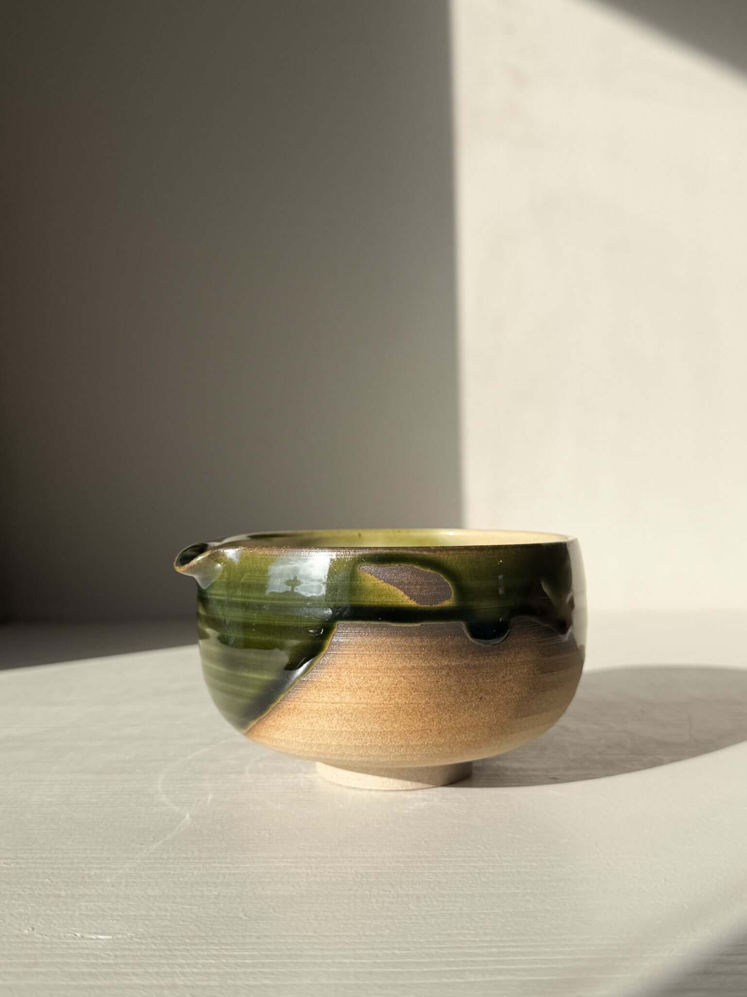 Matcha Bowl with Spout – Mori #02, handmade ceramic with green and brown glaze, part of the Mori Series