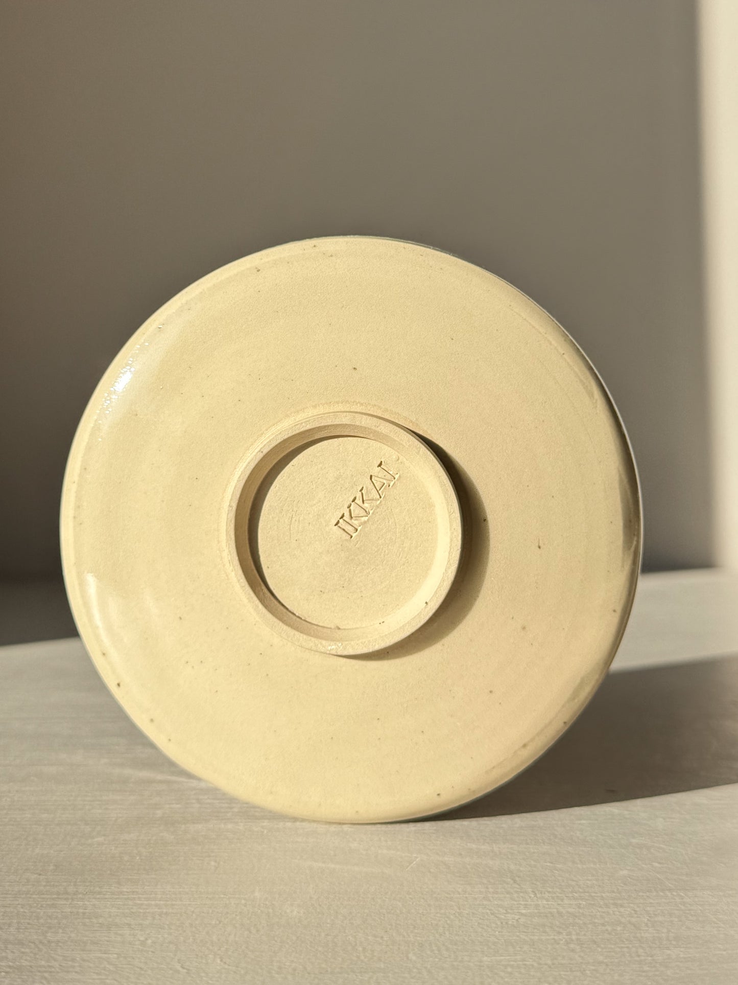 Bottom view of Textured Matcha Bowl Spout - Clear #02 showing stoneware and maker's mark