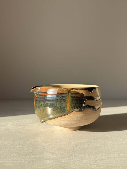 Handmade ceramic Matcha Bowl with Spout – Inyo #03 featuring tenmoku and clear glazes on stoneware. Unique wheel-thrown design.