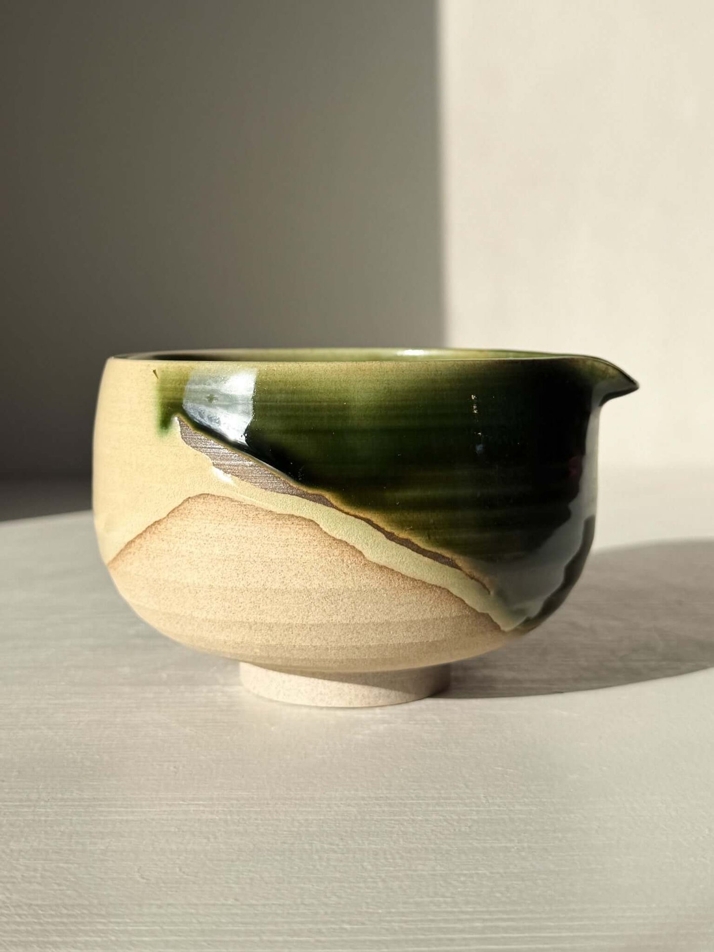 Handmade ceramic Matcha Bowl with Spout – Mori #04, featuring natural stoneware and layered green and brown glazes.