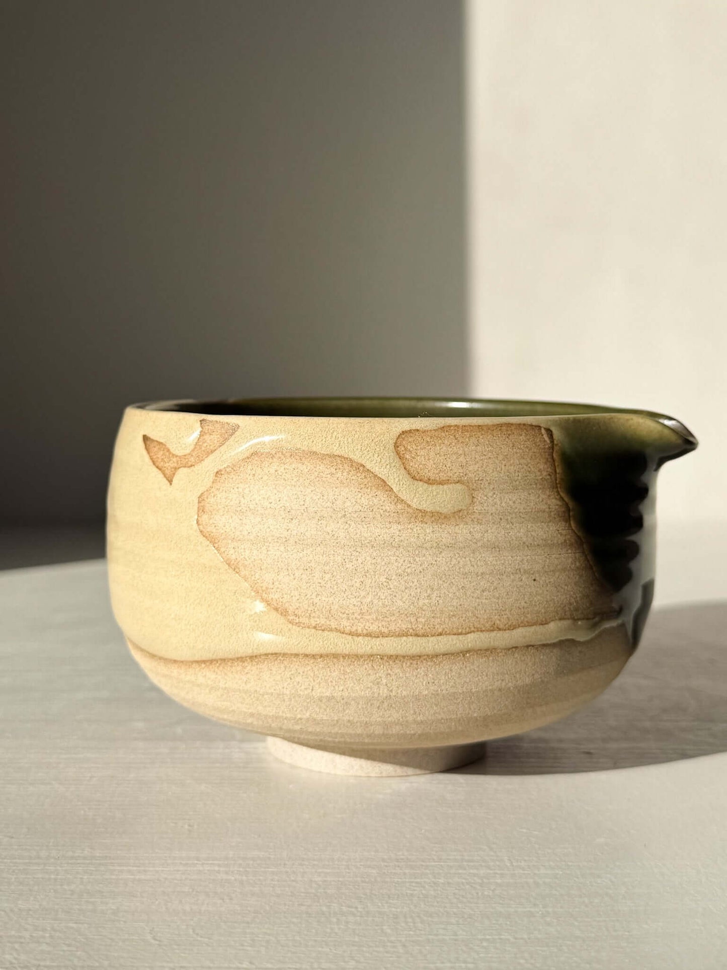 Handmade ceramic Matcha Bowl with Spout – Mori #03, featuring natural stoneware with green and brown glazes, side view.