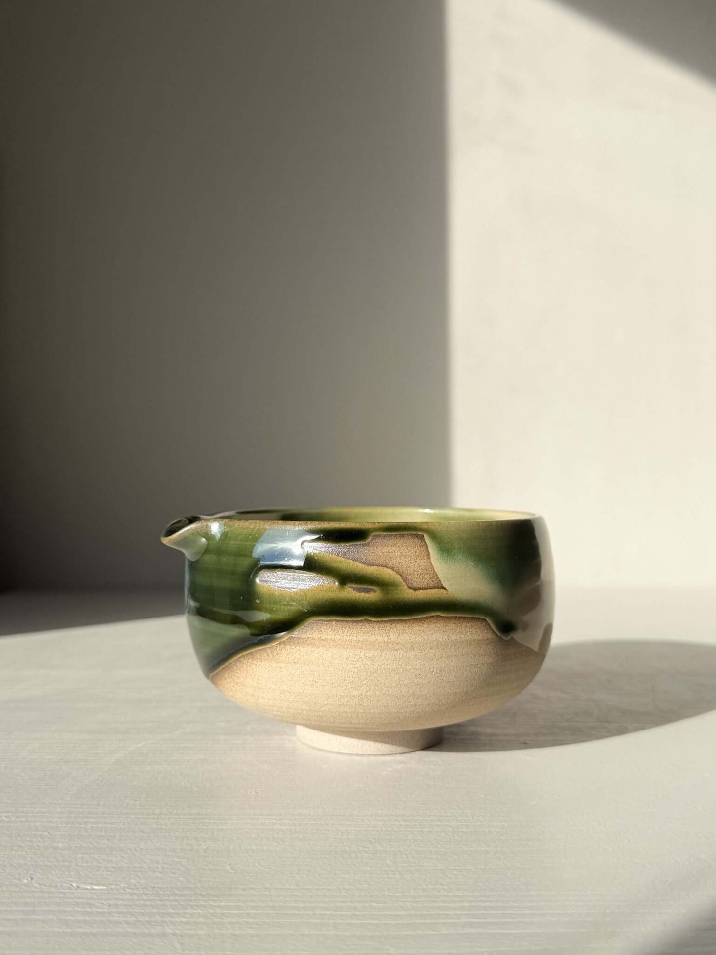 Matcha Bowl with Spout – Mori #05, handmade ceramic with green and brown glazes, part of the Mori Series, wheel-thrown craftsmanship