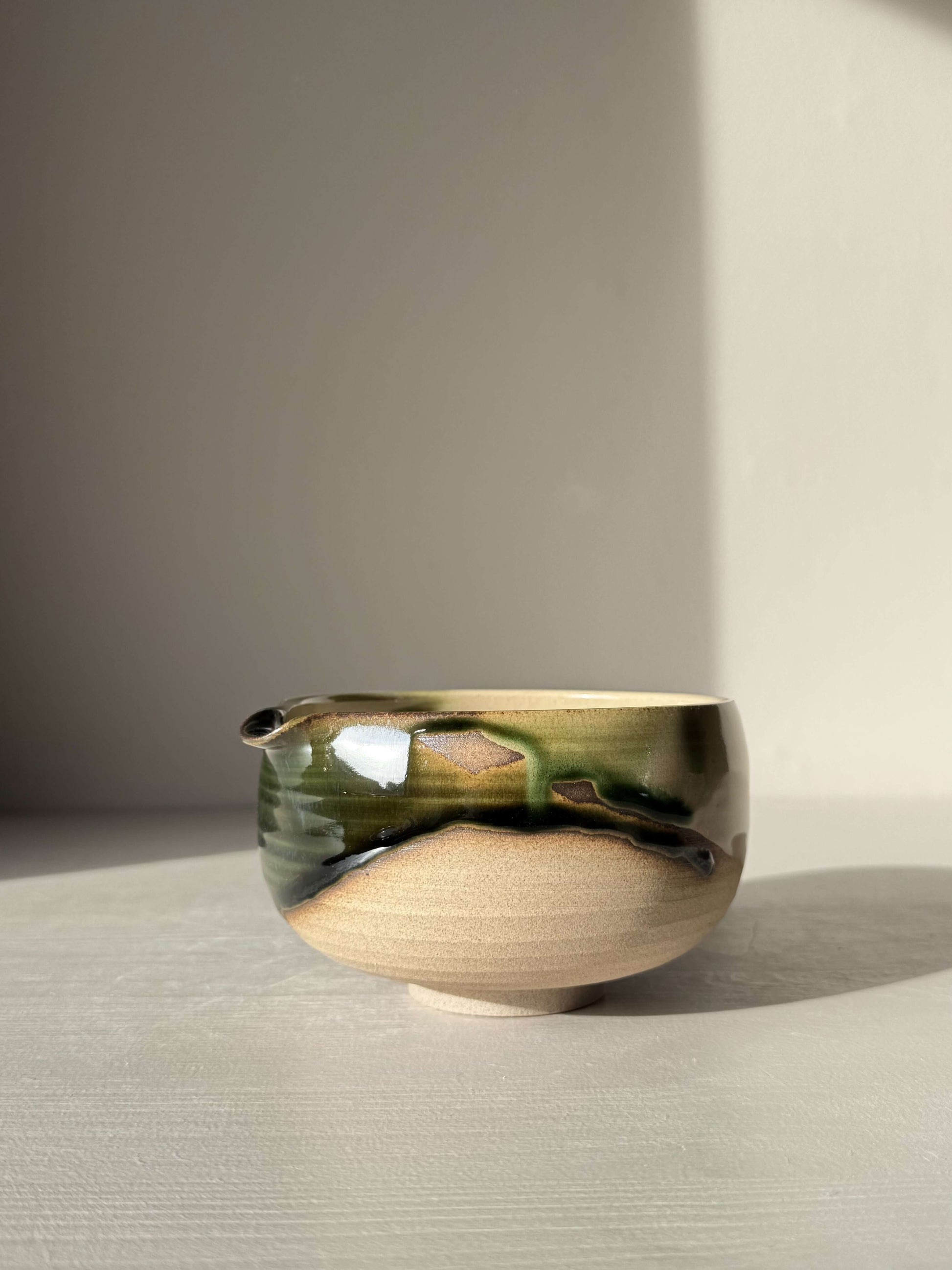 Matcha Bowl with Spout – Mori #06, handmade ceramic with layered green and brown glazes, part of the Mori Series.