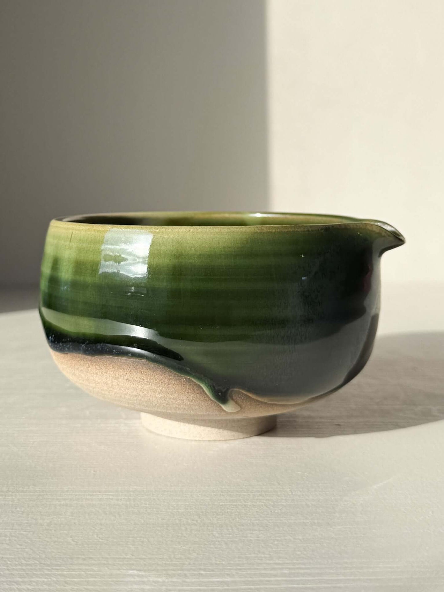 Matcha Bowl with Spout – Mori #05, handmade ceramic with layered green and brown glazes, part of the Mori Series.