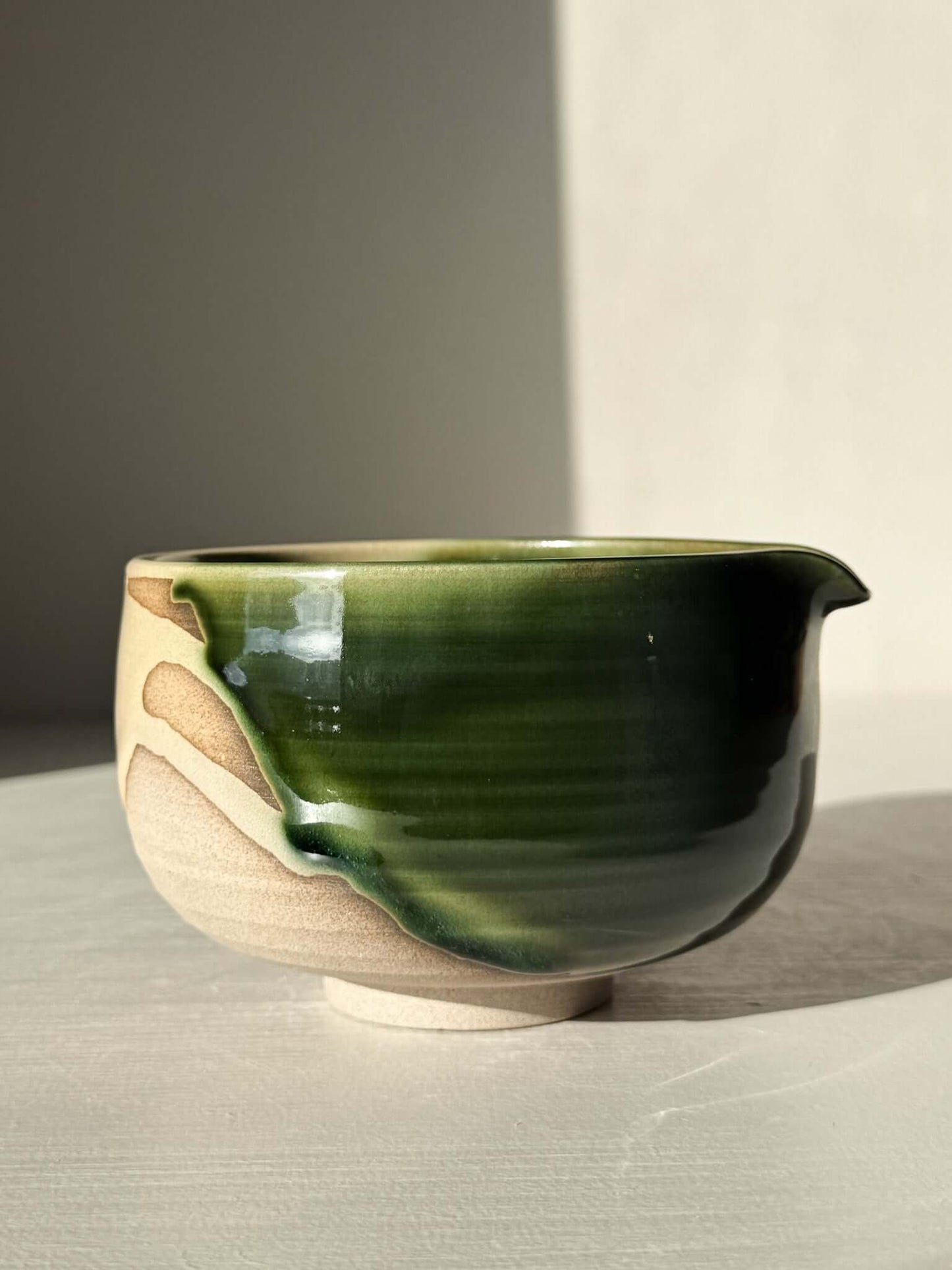 Handmade ceramic Matcha Bowl with Spout – Mori #01 featuring natural stoneware and green-brown layered glazes.
