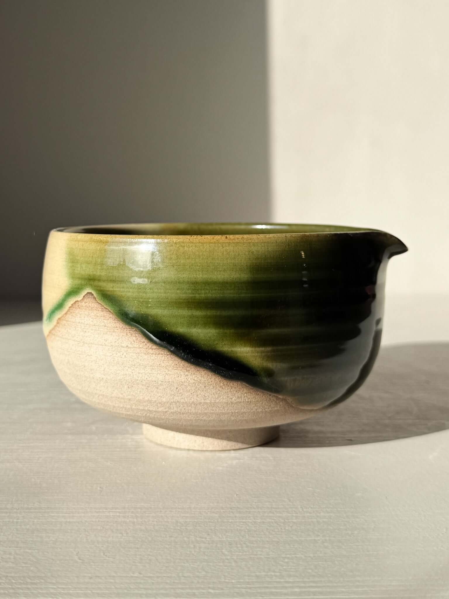 Handmade ceramic Matcha Bowl with Spout – Mori #02 with green and brown glazes, part of the Mori Series, natural stoneware