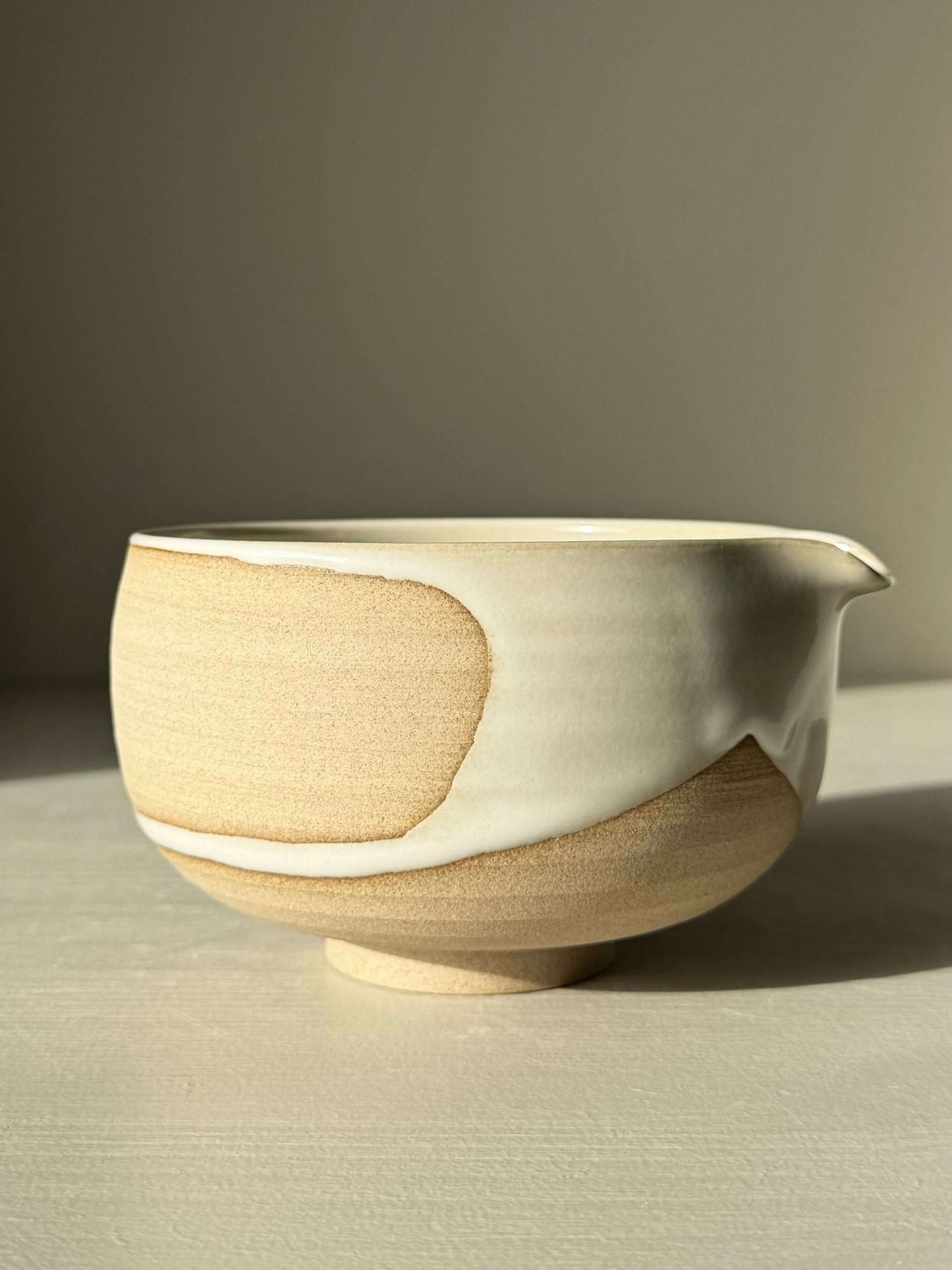 Matcha Bowl with Spout – Yuki #04, handmade ceramic, featuring toffee clay and white glaze. Unique, artisanal design for daily rituals.