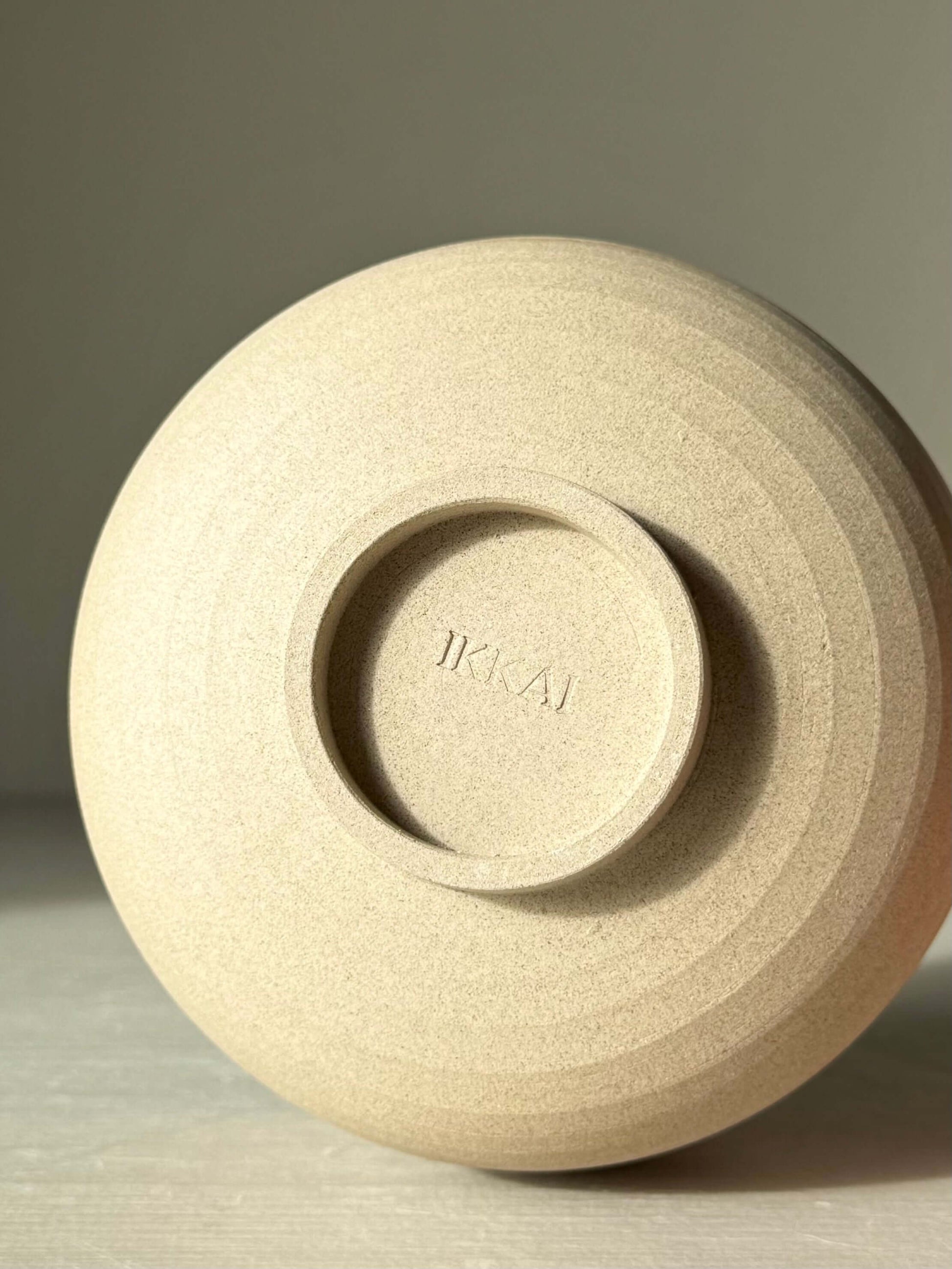 Base view of Matcha Bowl with Spout – Yuki #01, featuring handmade ceramic craftsmanship in toffee clay.