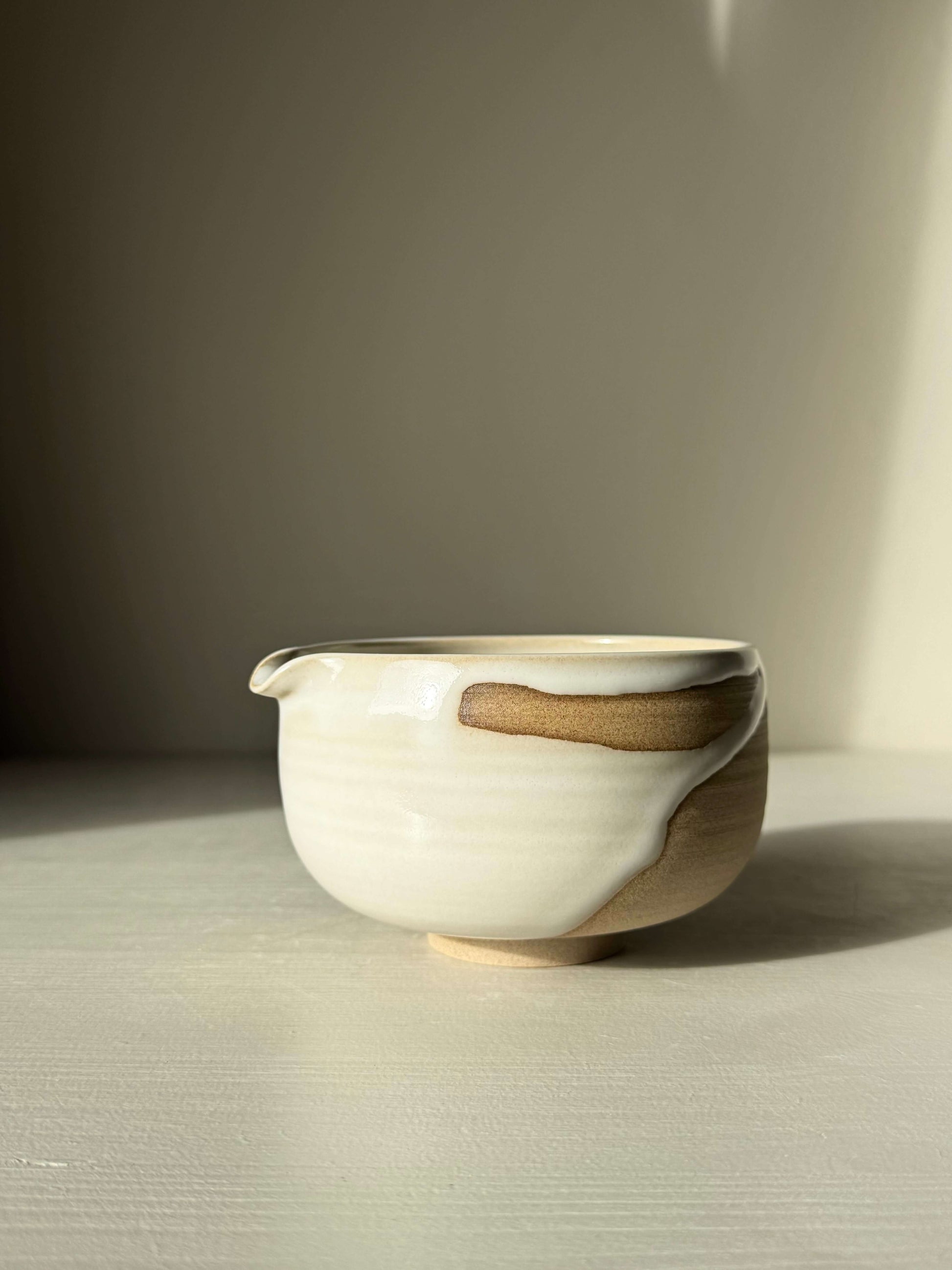 Handmade ceramic Matcha Bowl with Spout – Yuki #02 with glossy white glaze and toffee clay, perfect for a calming daily ritual.