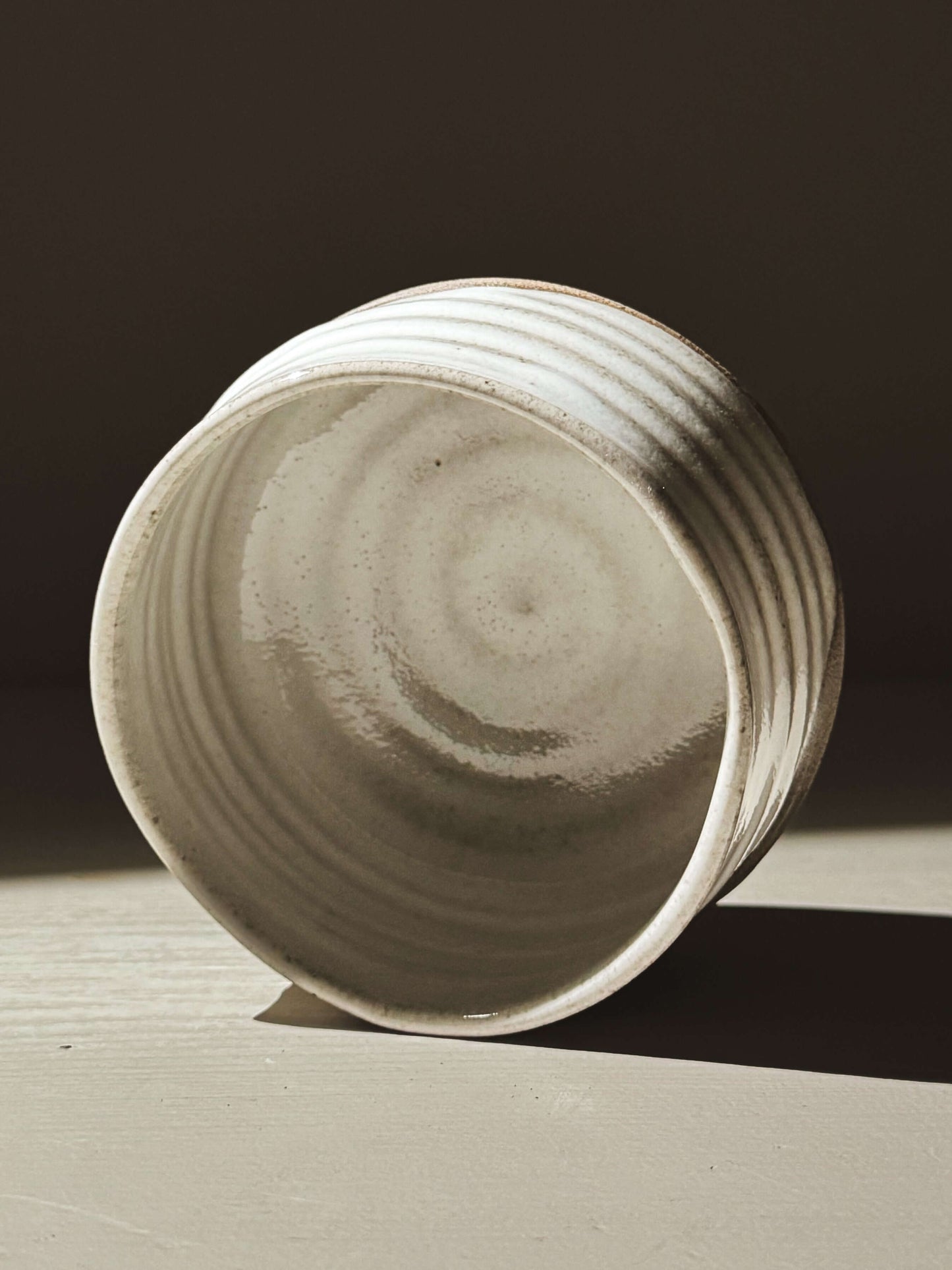 Matcha Bowl – Yuki Ash #03 featuring ash-grey clay and glossy white glaze with natural throwing lines and curves.