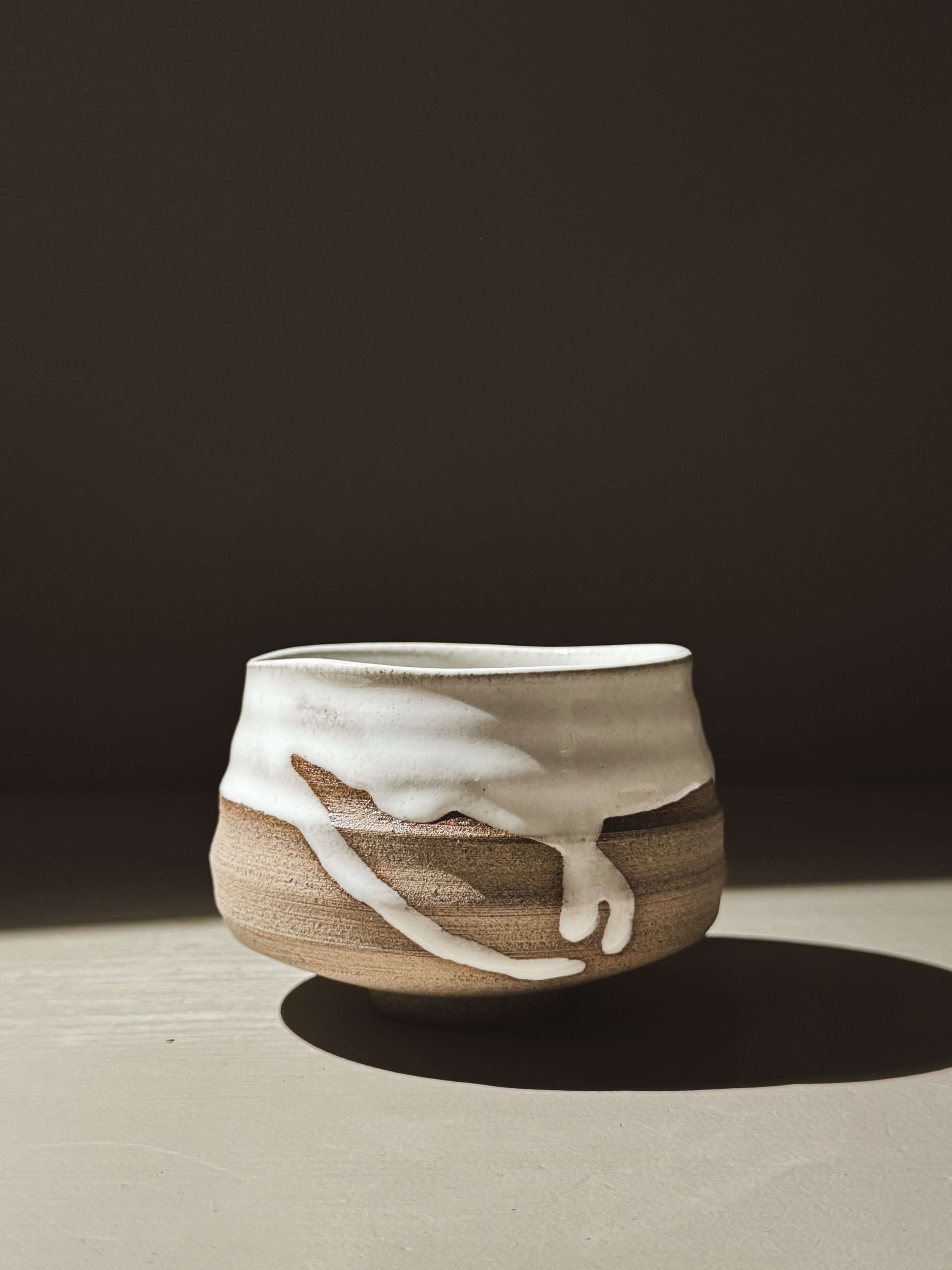 Matcha Bowl – Yuki Ash #04 with glossy white glaze on ash-grey clay displaying natural throwing lines and soft curves