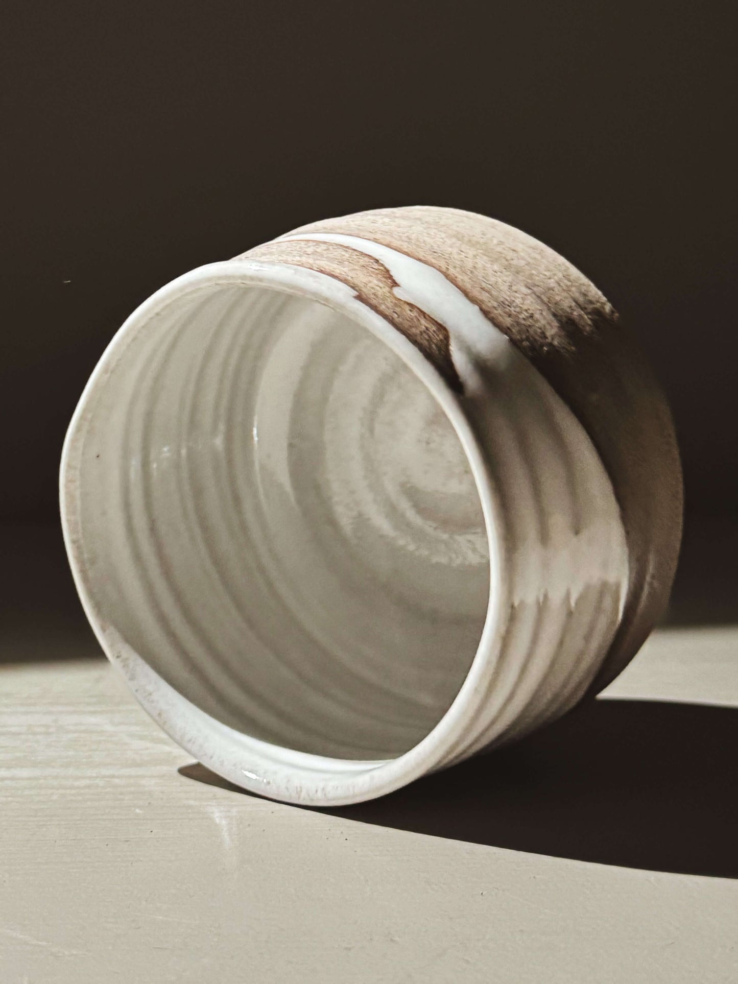 Matcha Bowl – Yuki Ash #02 with glossy white glaze and ash-grey clay, showing curves and natural glaze movement.