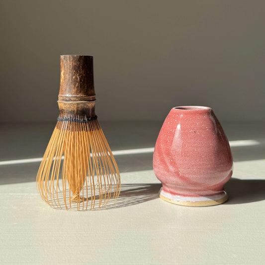 Matcha Whisk Holder - Ume Series with handmade ceramic design next to a bamboo whisk, inspired by Japanese plum blossom.