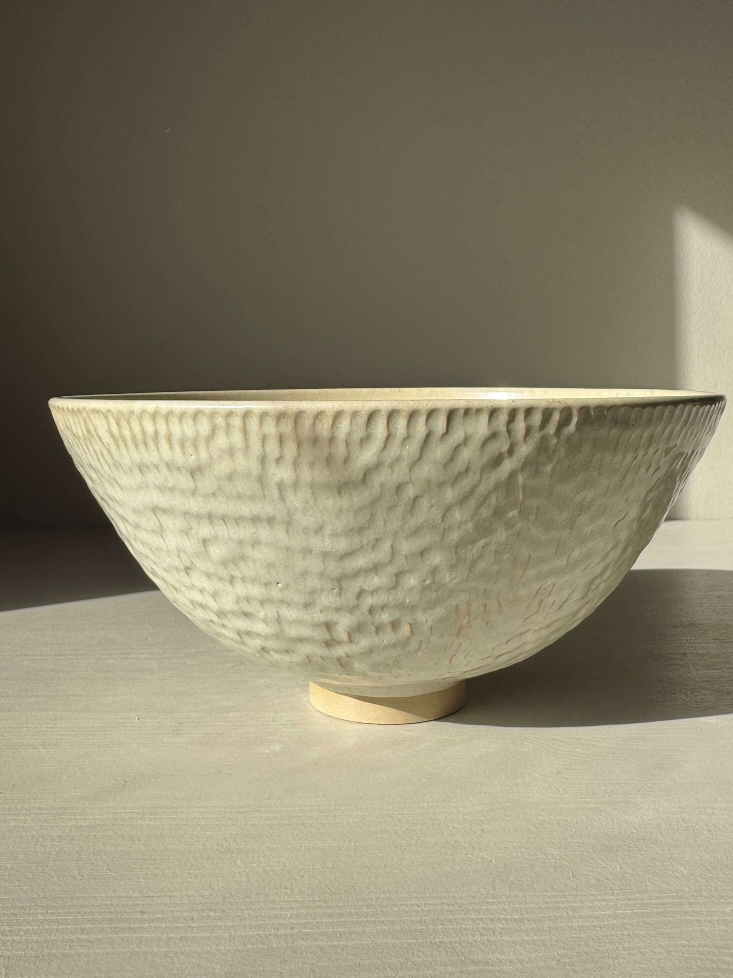 Medium Bowl – Moonstone with handmade ceramic texture and creamy satin finish in warm light.