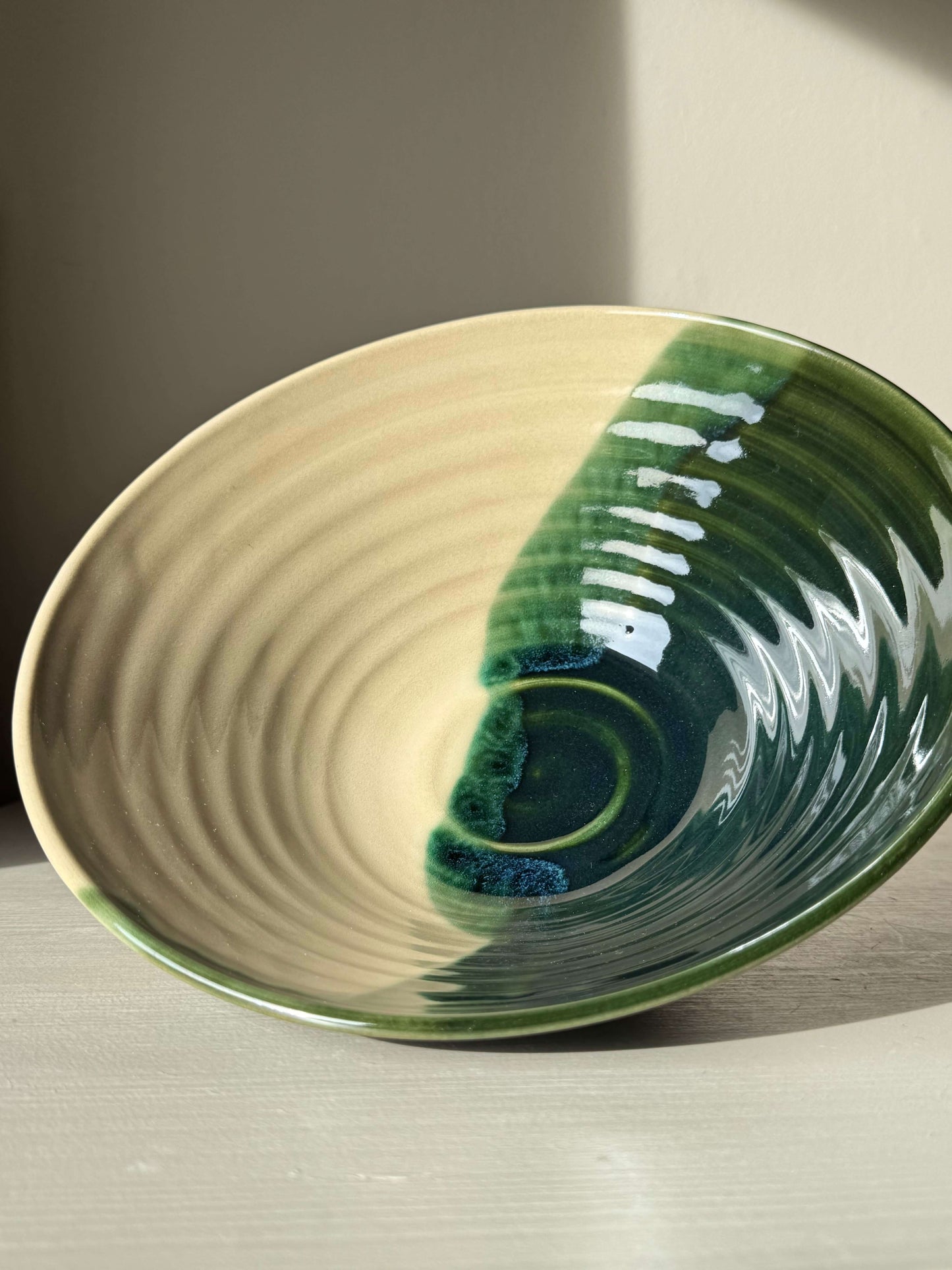 Handmade ceramic Medium Bowl - Mori #01 with rich green glaze and toffee-colored clay, part of the Mori Series collection.