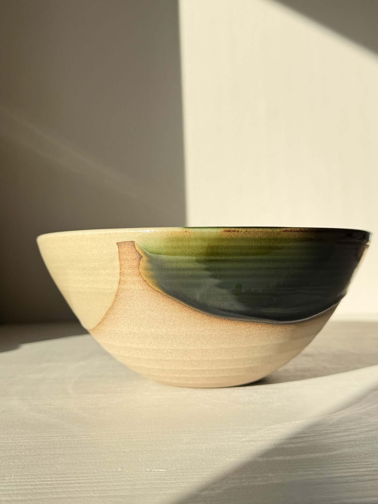 Medium Bowl - Mori #02, handmade ceramic with rich green glaze flowing into darker tones over toffee-colored clay, deep and rounded form.