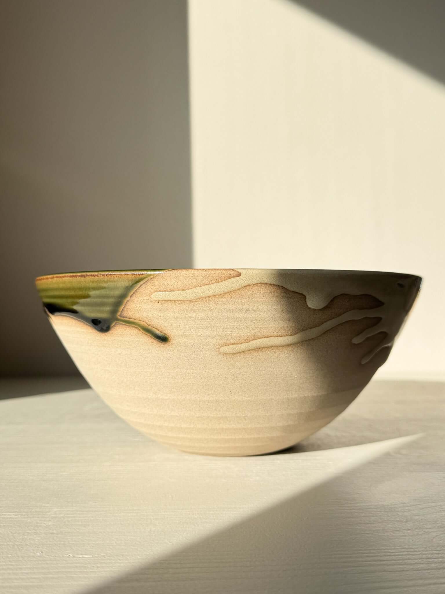 Medium Bowl - Mori #02 handmade ceramic with green glaze and raw toffee clay rim, deep rounded form inspired by forest calm.