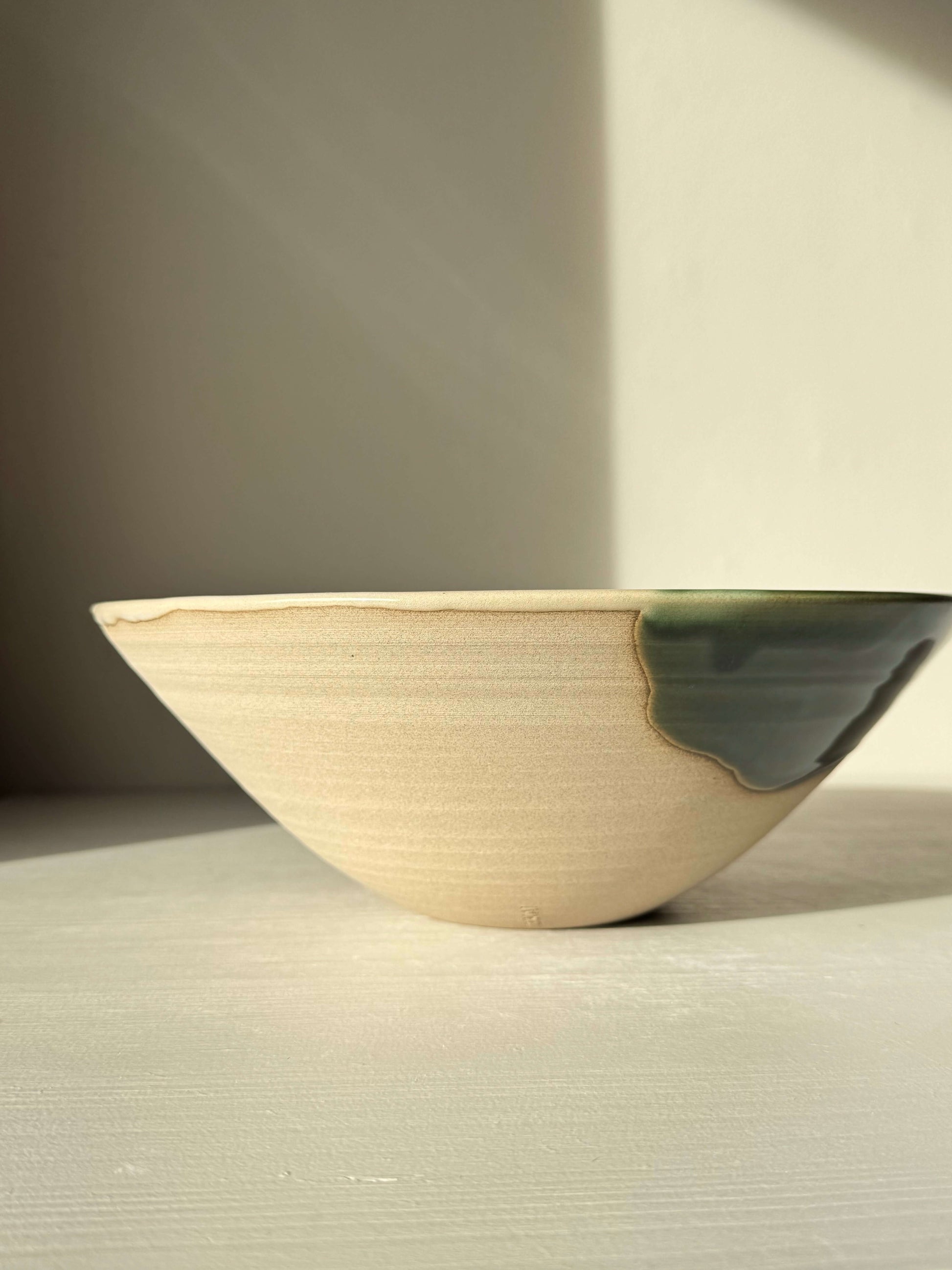 Medium Bowl - Mori #01 handmade ceramic bowl with green glaze on toffee-colored clay, showcasing a forest-inspired design.