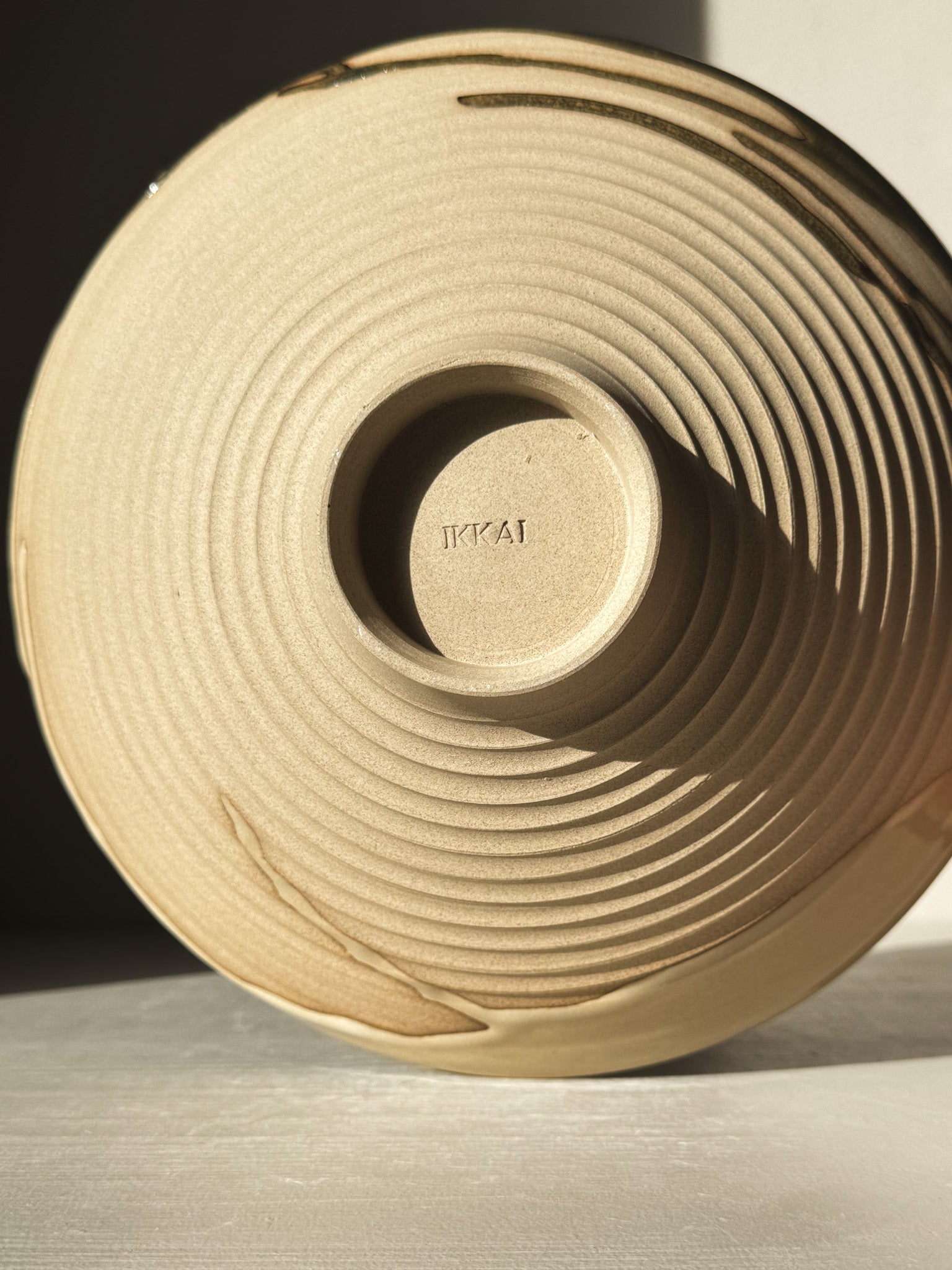 Medium Carved Bowl - Inyo #02 with sculptural carved exterior and raw clay showcasing natural flowing drips along the rim.