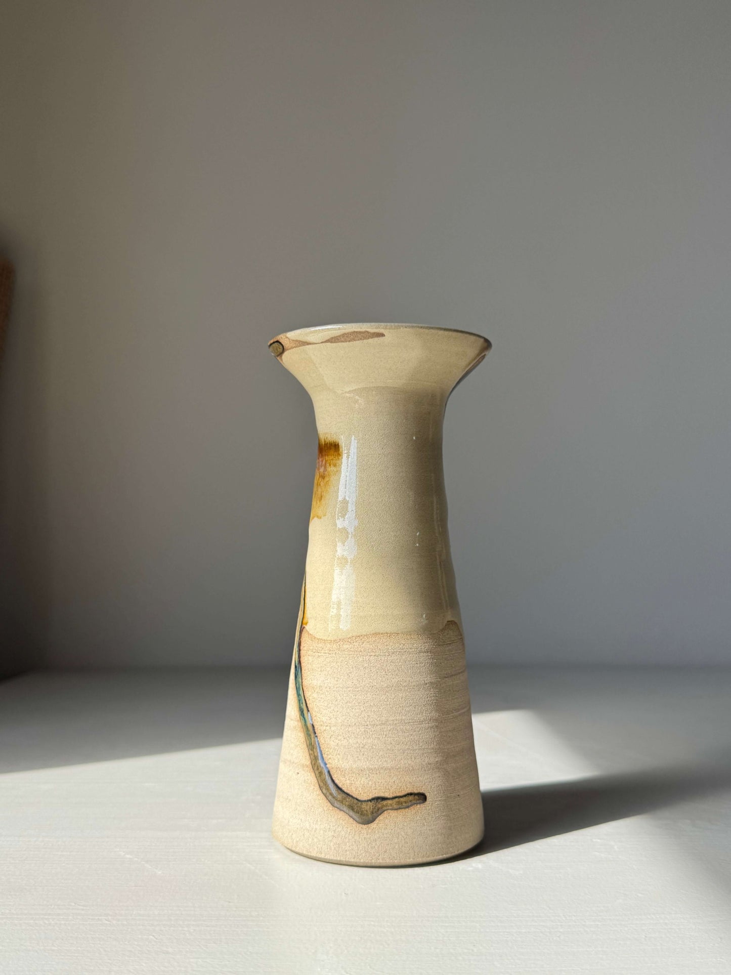Medium Vase – Inyo Series #03, handmade ceramic, tall sculptural vase with unique glaze, stands on a light surface.