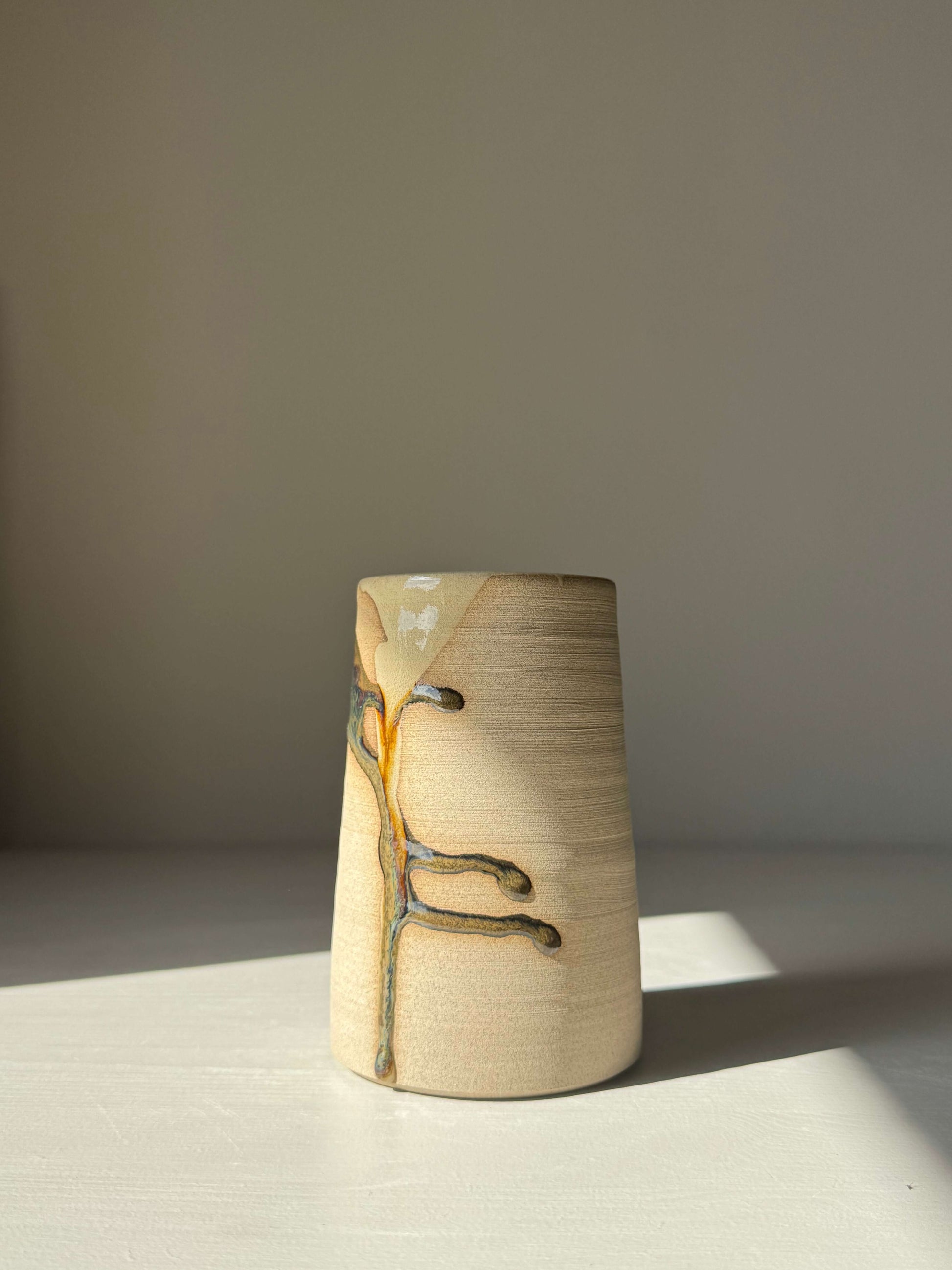 Medium Vase / Jug – Inyo Series handmade ceramic with natural glaze and sculptural texture on a smooth unglazed surface.