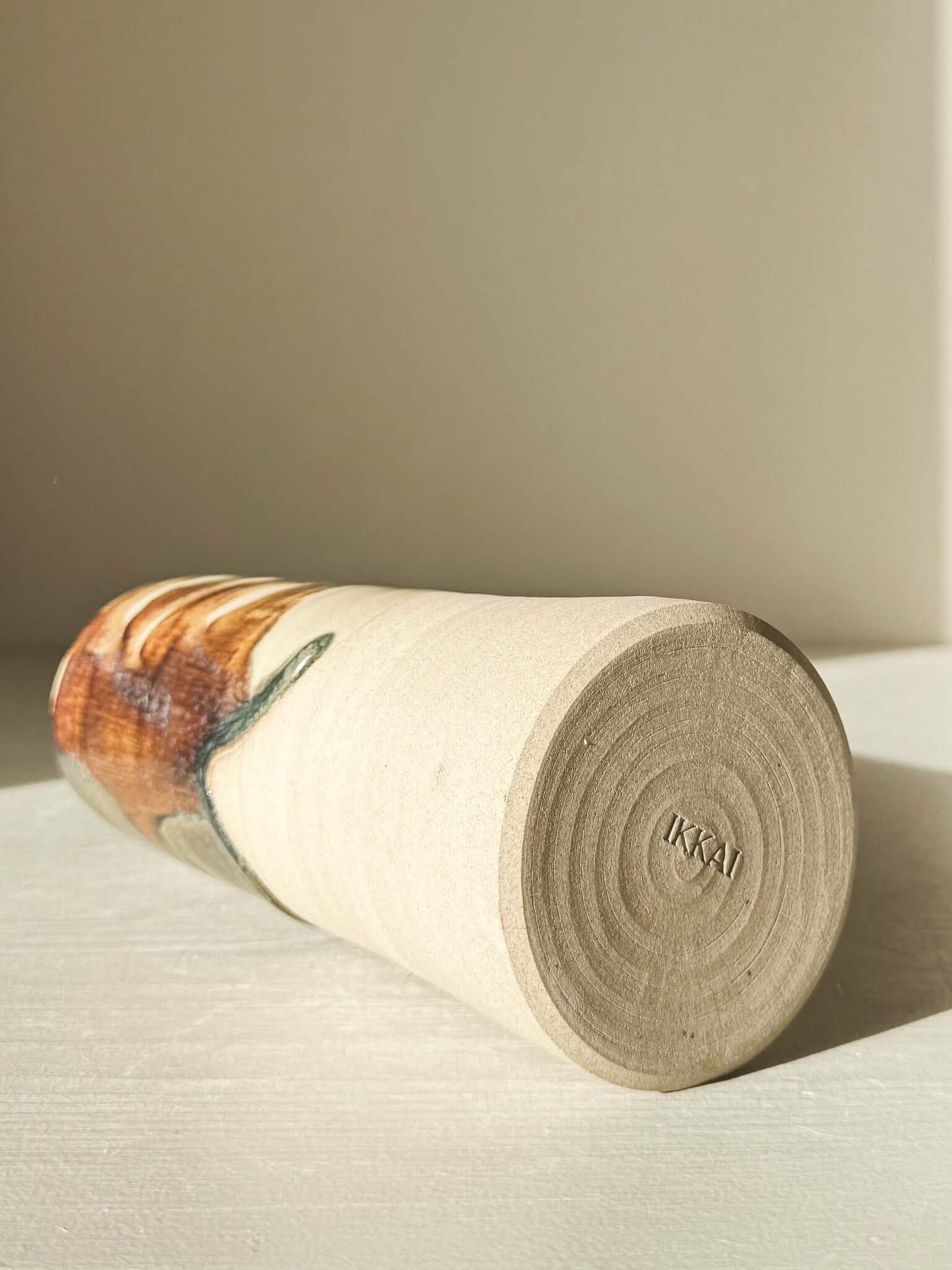 Medium Vase - Inyo Series lying on its side showcasing raw texture and glaze detail