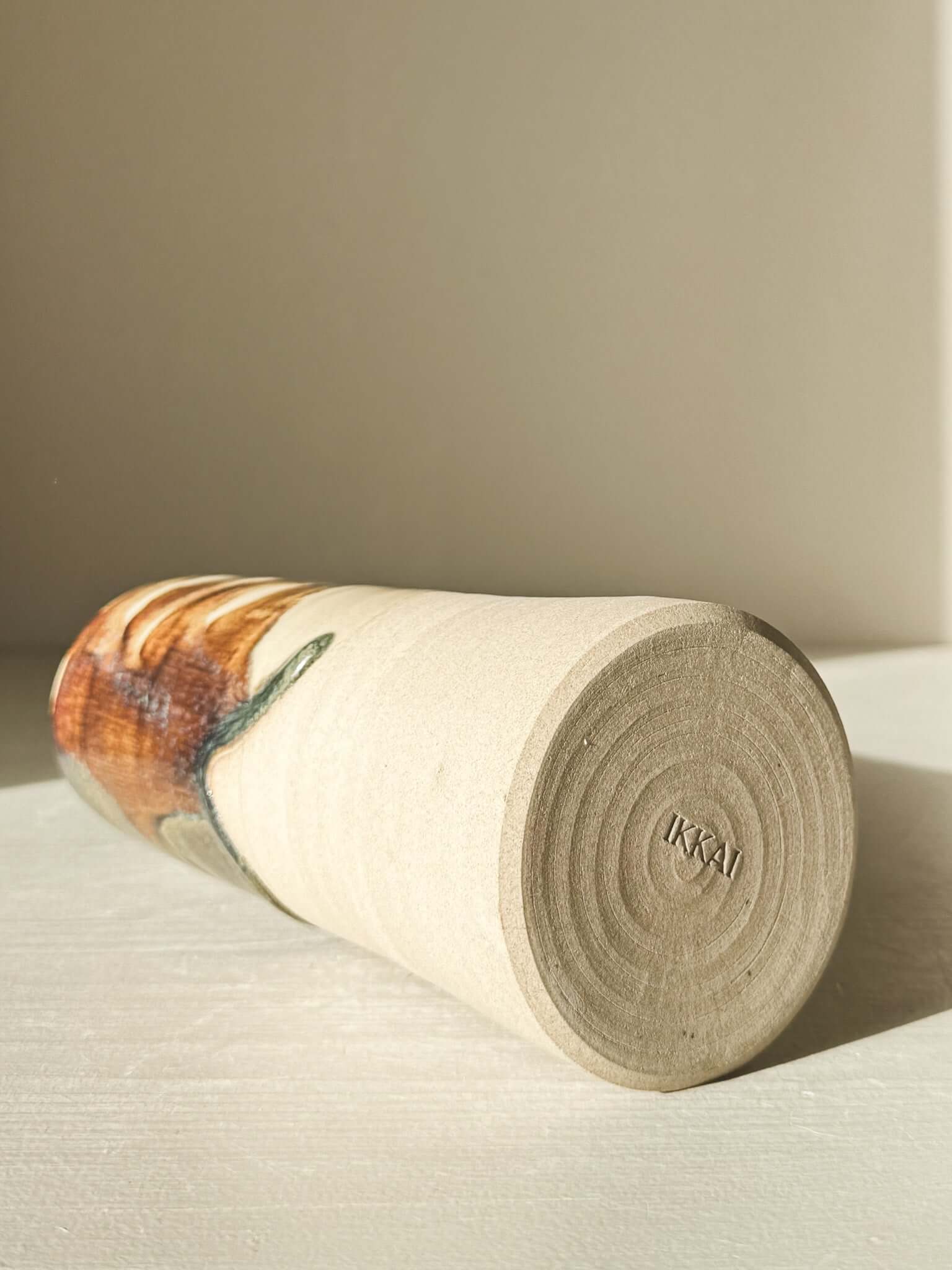 Medium Vase - Inyo Series lying on its side showcasing raw texture and glaze detail