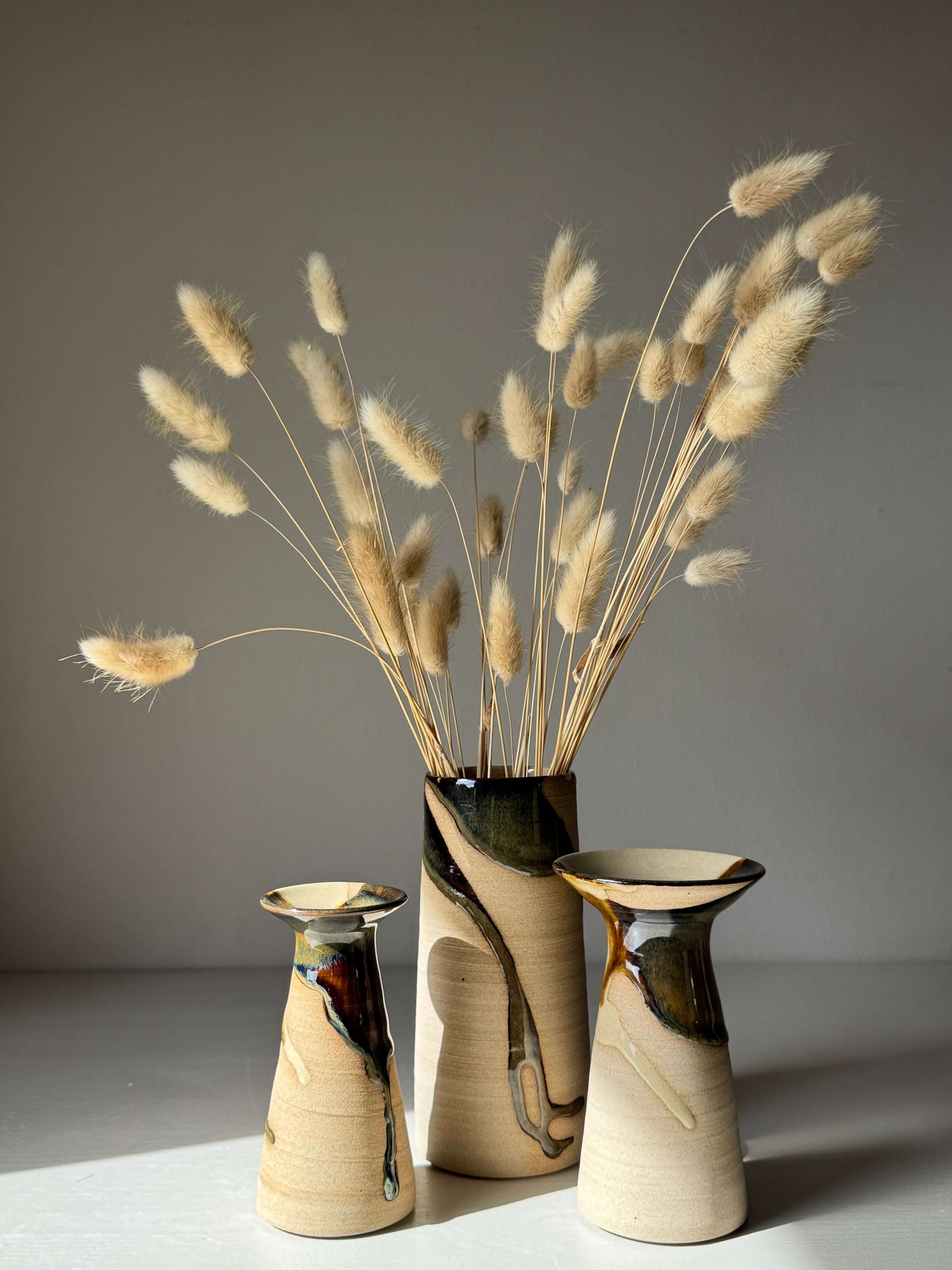Medium Vase - Inyo Series, handmade ceramic with tenmoku glaze, displaying natural texture and flowing design.