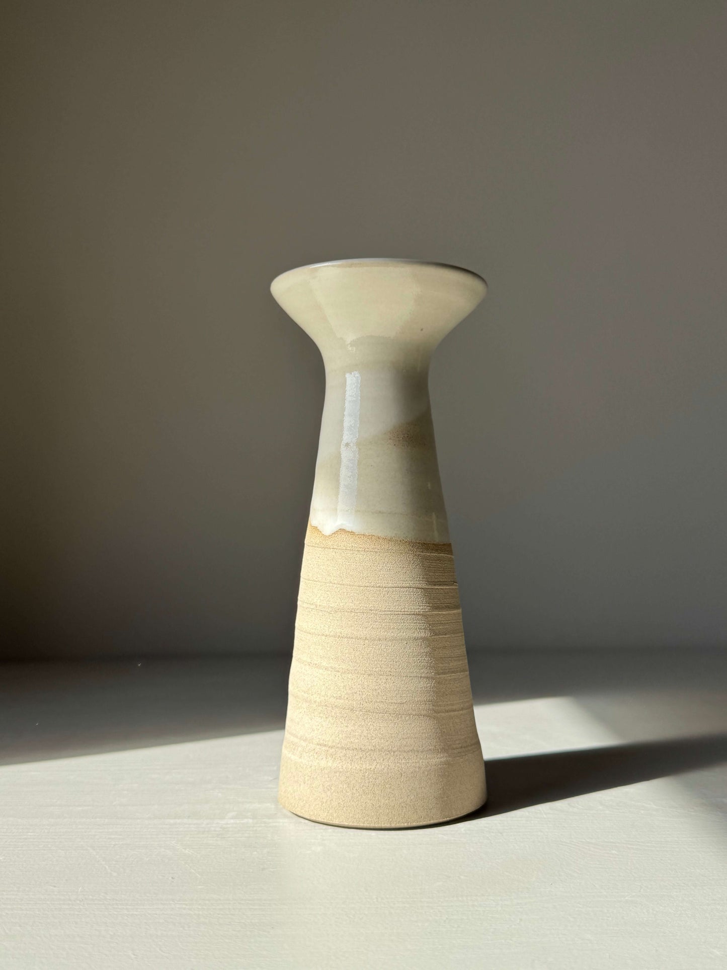 Medium Vase – Yuki #02, handmade ceramic vase with glossy white glaze on warm stoneware, featuring a tall, gracefully flared silhouette.