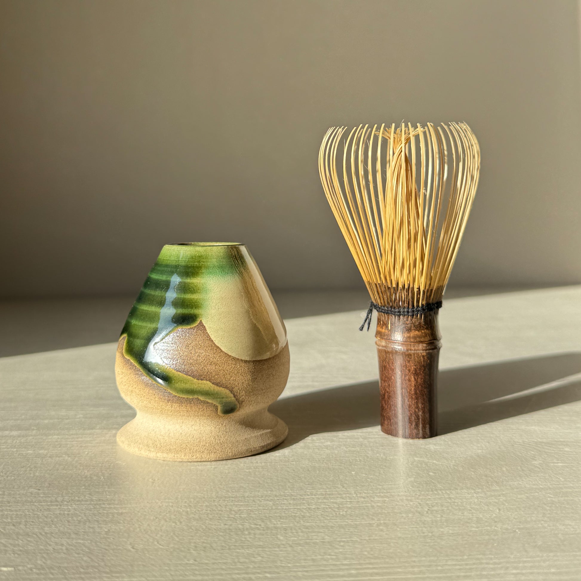 Whisk Holder - Mori matcha holder with bamboo chasen, featuring a glossy green and stoneware finish for a calming tea experience.