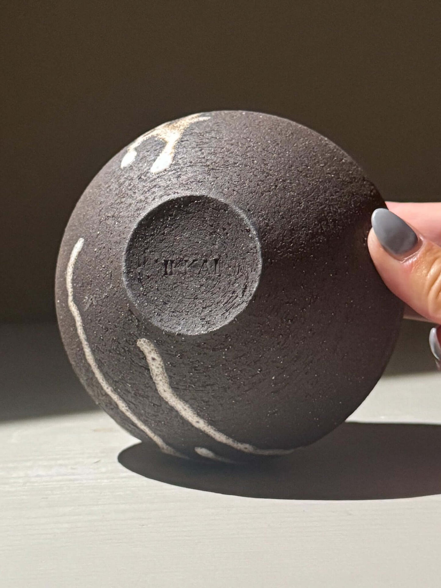 Orb Vase – Matt Clear shown in a close-up view, highlighting its textured surface and unique glaze patterns.
