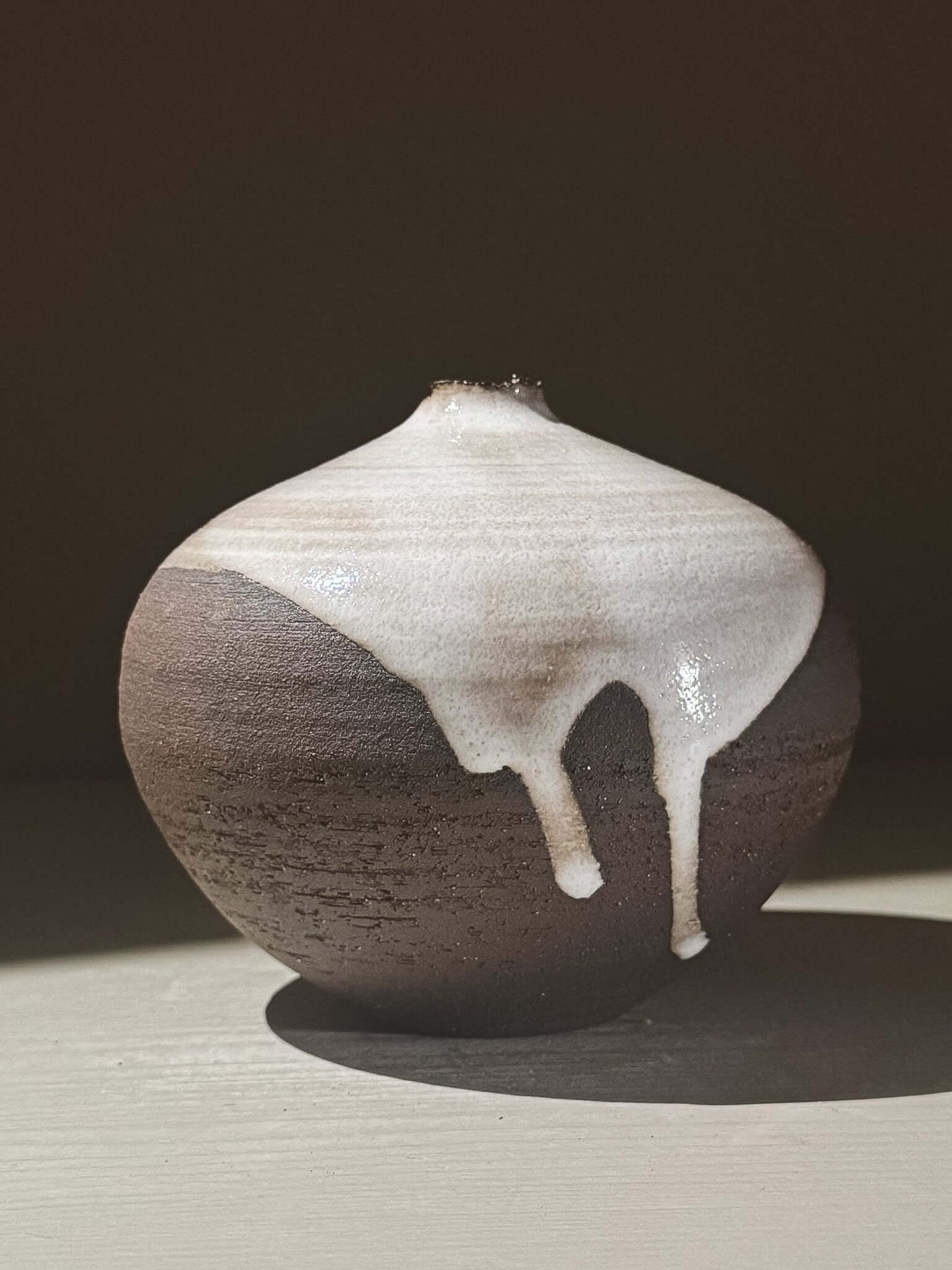 Orb Vase – Yuki Black #02 with unique glaze drips and soft spherical form, adding a calm, sculptural presence.