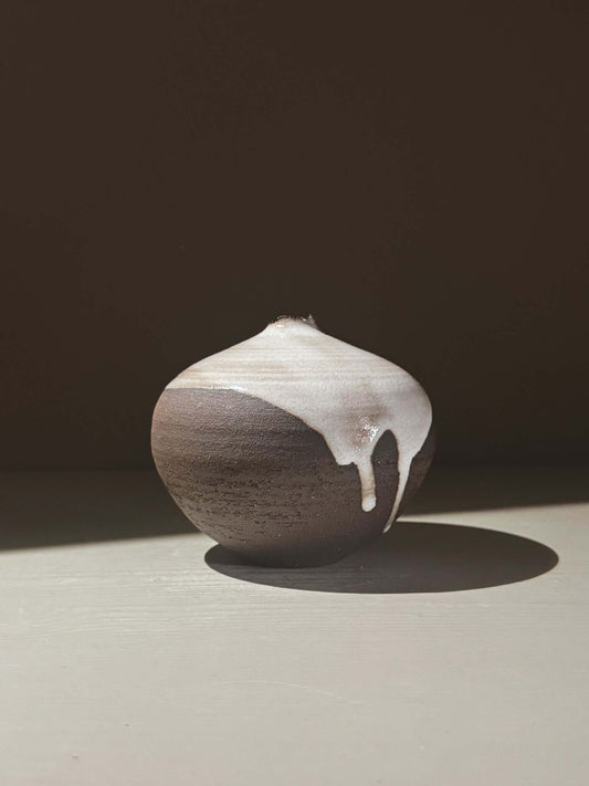 Orb Vase – Yuki Black #02 showcasing a unique glaze with gentle drips and a sculptural presence.