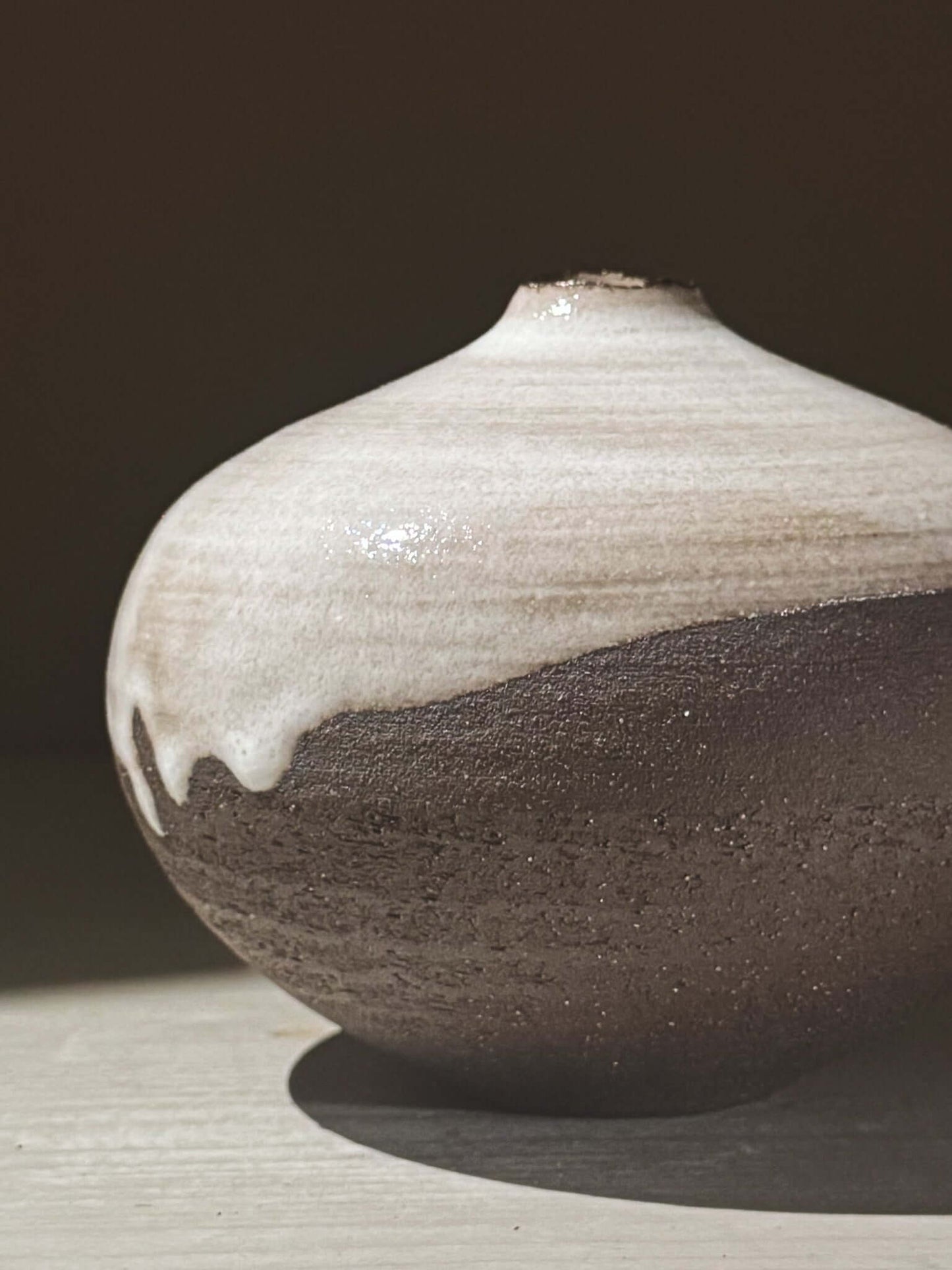 Orb Vase – Yuki Black #03 featuring unique glaze patterns and a soft spherical form, perfect for elegant decor.
