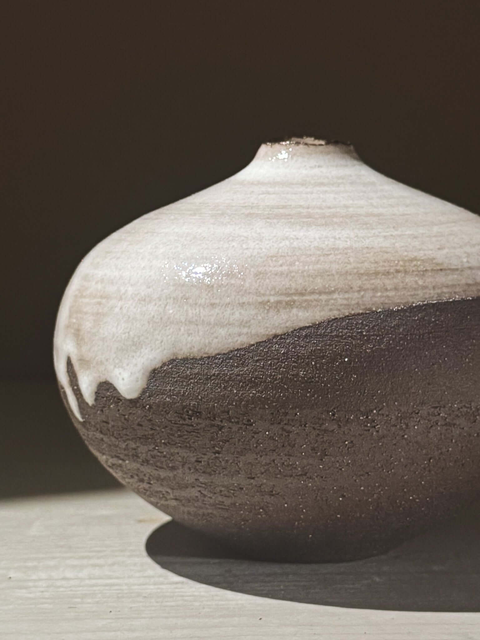 Orb Vase – Yuki Black #03 featuring unique glaze patterns and a soft spherical form, perfect for elegant decor.